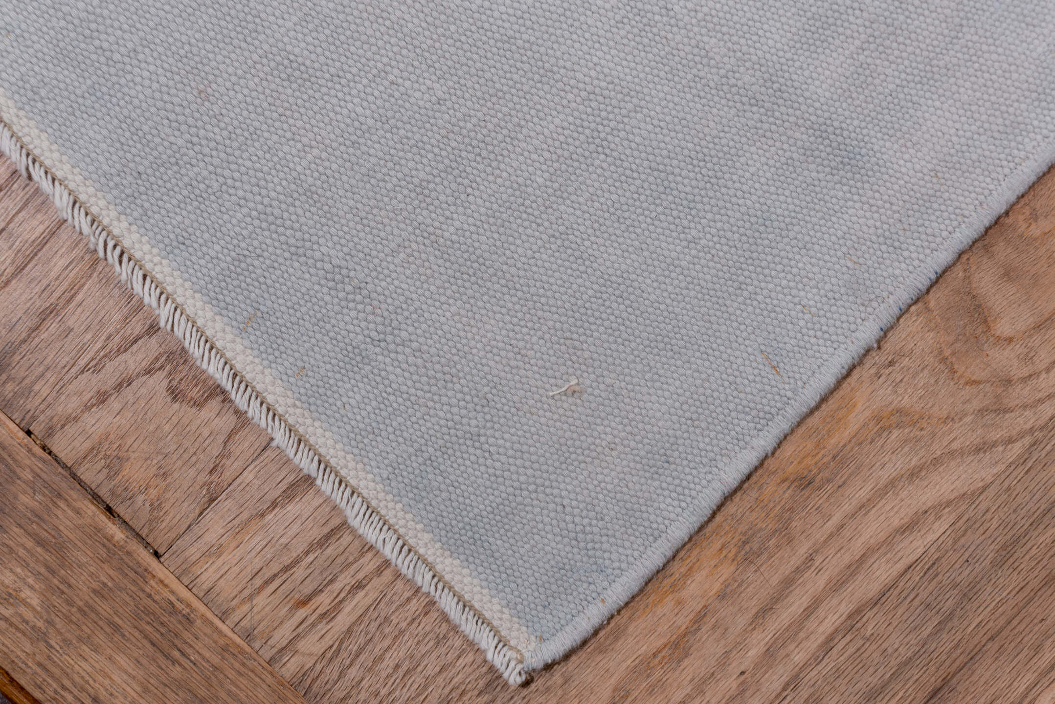 9' x 17' one-of-a-kind handmade antique Dhurrie rug. Color palette: pale blue, ivory, sky blue, light blue