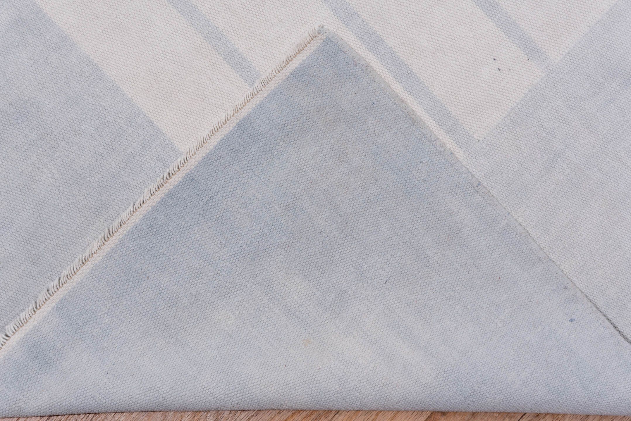 9' x 17' one-of-a-kind handmade antique Dhurrie rug. Color palette: pale blue, ivory, sky blue, light blue