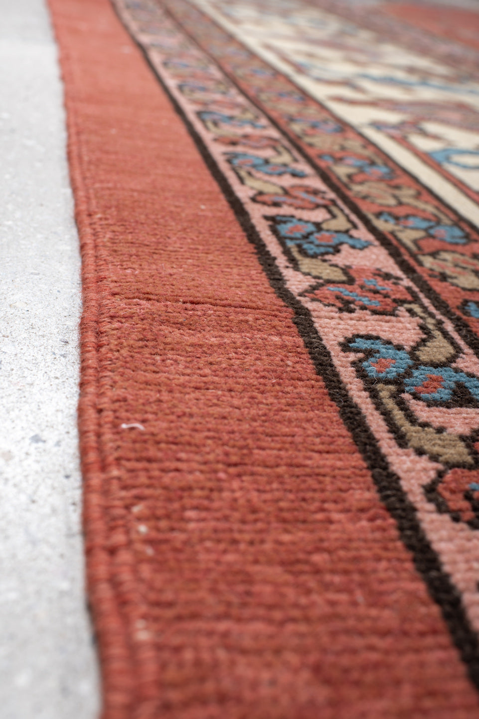 11' x 16' one-of-a-kind handmade vintage Serapi oversize rug. Color palette: terra cotta, ivory, sky blue, navy, rose