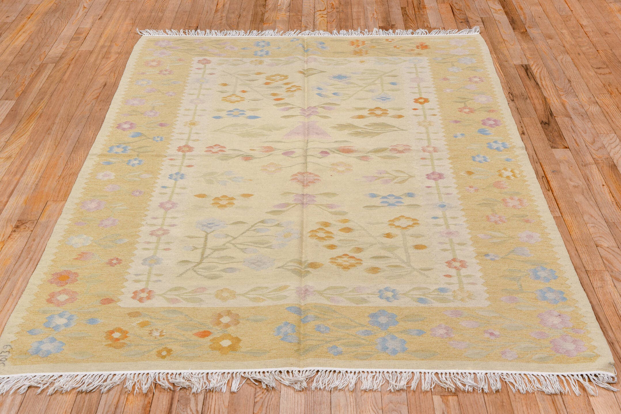 4' x 7' one-of-a-kind handmade antique Besserabian rug. Color palette: ivory, gold, camel, sky_blue, blush, sage, peach