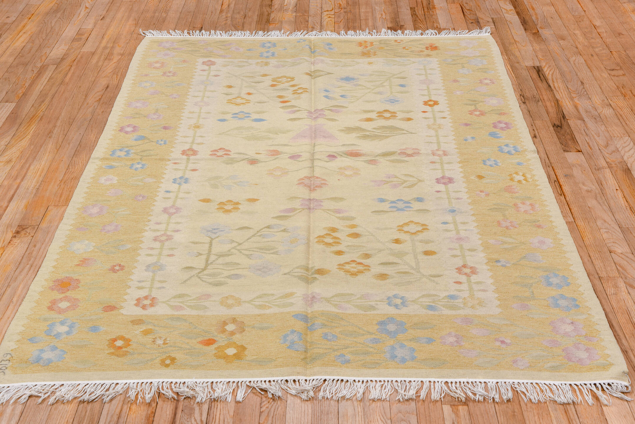 4' x 7' one-of-a-kind handmade antique Besserabian rug. Color palette: ivory, gold, camel, sky_blue, blush, sage, peach