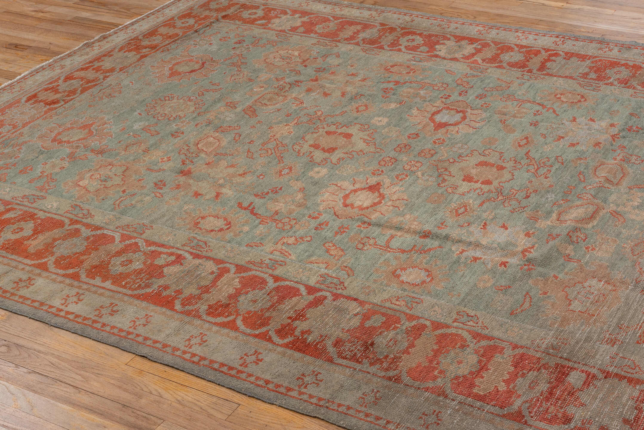 7' x 9' one-of-a-kind handmade antique Oushak rug. Color palette: sage, terra cotta, ivory, taupe, rose, beige, green
