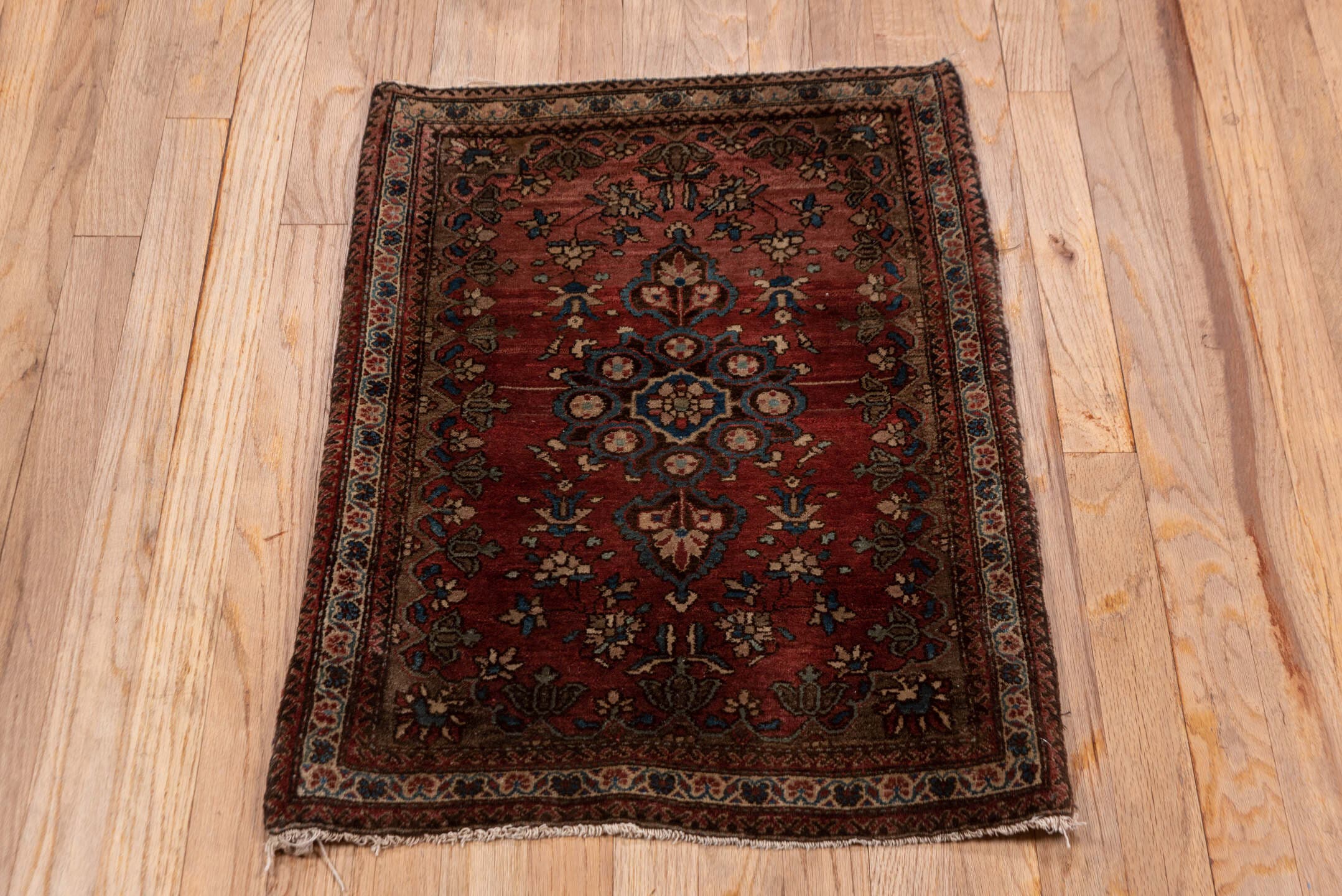 1' x 2' one-of-a-kind handmade antique Sarouk small size rug. Color palette: rust, burgundy, ivory, navy, camel, rose, brown