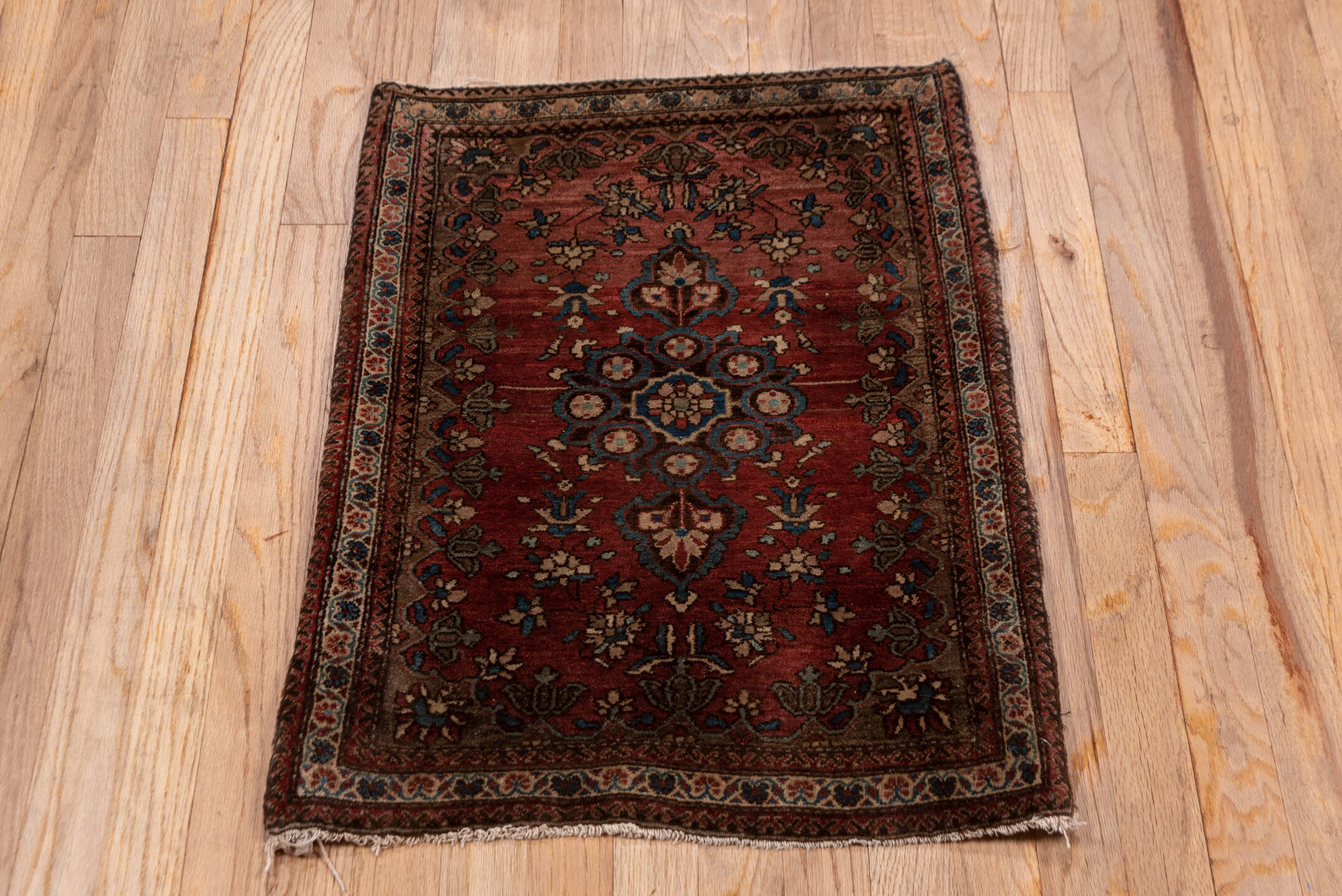 1' x 2' one-of-a-kind handmade antique Sarouk small size rug. Color palette: rust, burgundy, ivory, navy, camel, rose, brown