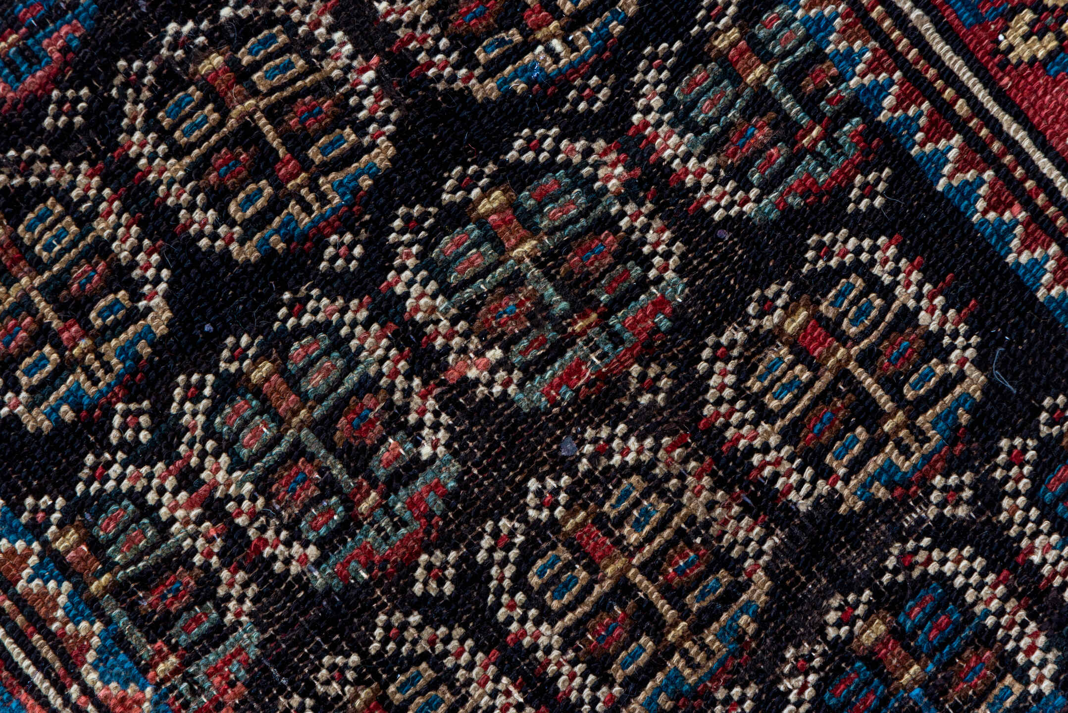 2' x 12' one-of-a-kind handmade antique Caucasian runner rug. Color palette: navy, rust, slate, ivory, rose, teal, charcoal