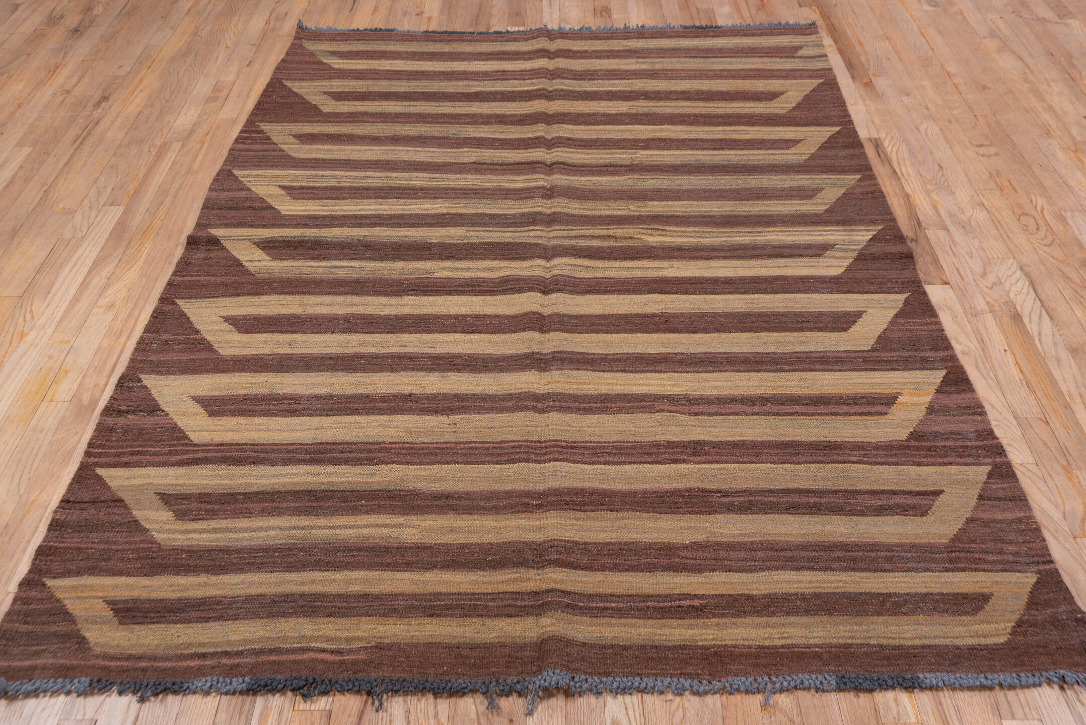 5' x 8' one-of-a-kind handmade vintage Kilim medium size rug. Color palette: brown, camel, taupe, mahogany, charcoal, beige