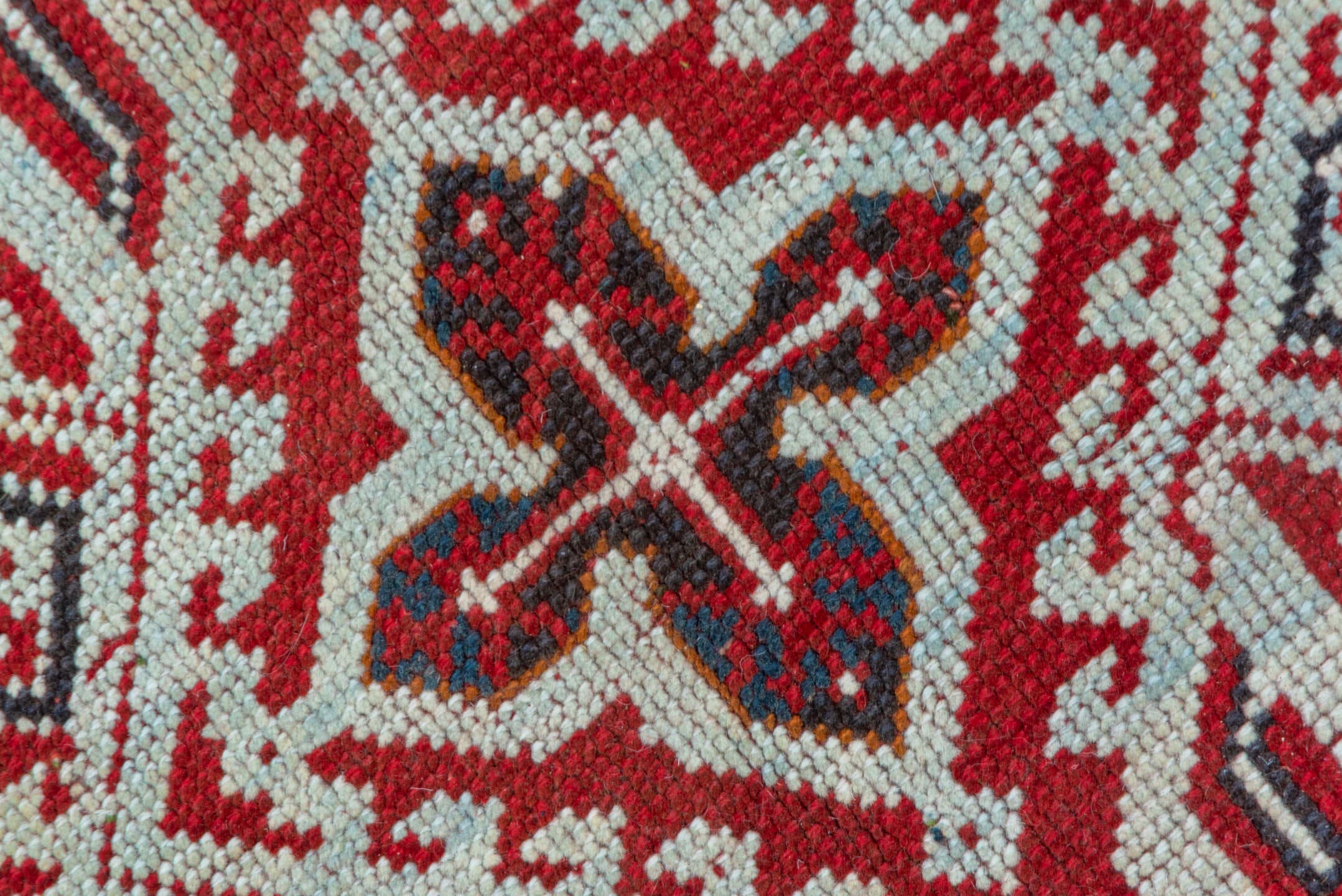 3' x 11' one-of-a-kind handmade vintage Tulu runner rug. Color palette: terracotta, ivory, crimson, charcoal, brown, red