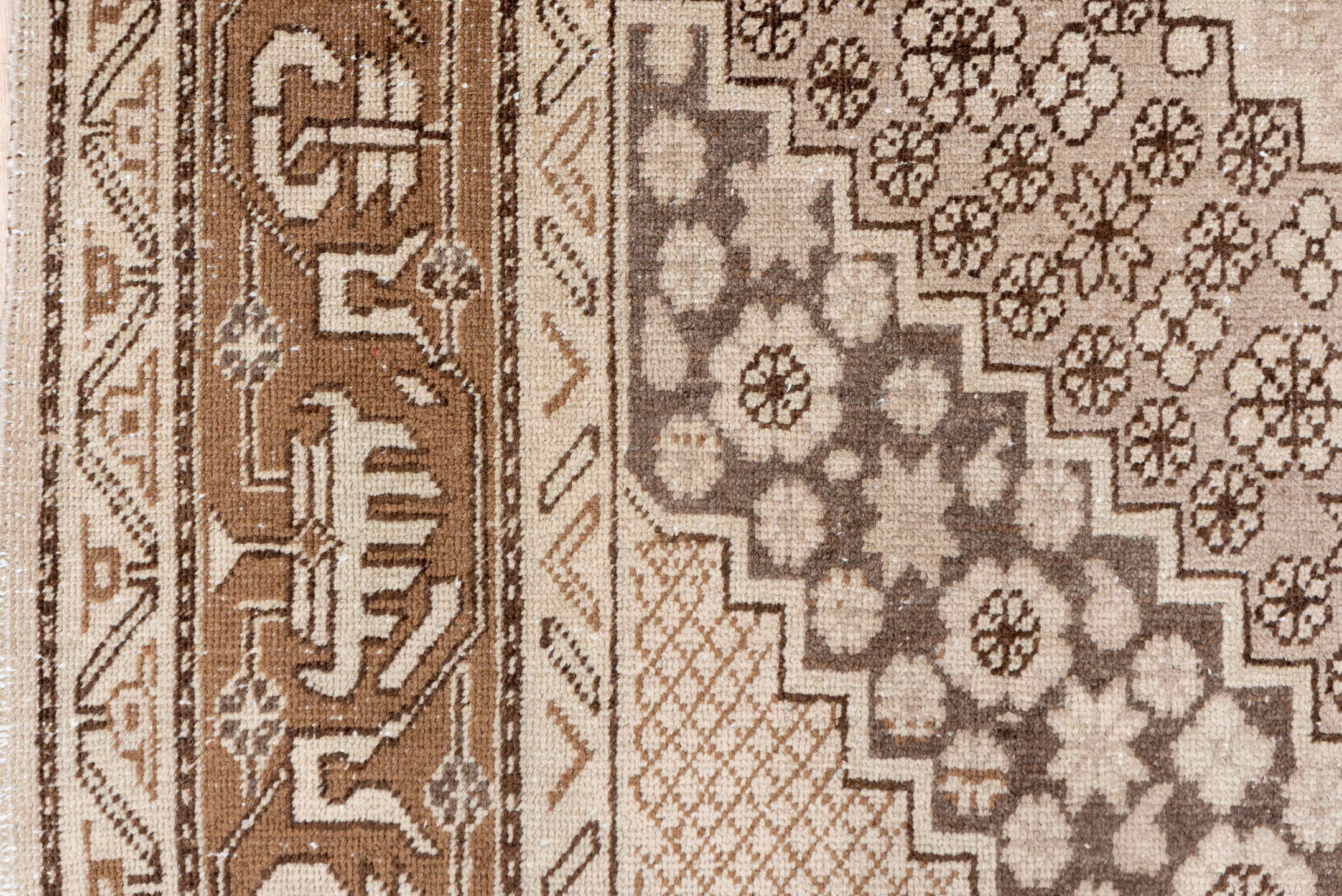 5' x 8' one-of-a-kind handmade vintage Khotan medium size rug. Color palette: brown, gray, light gray, off-white, orange