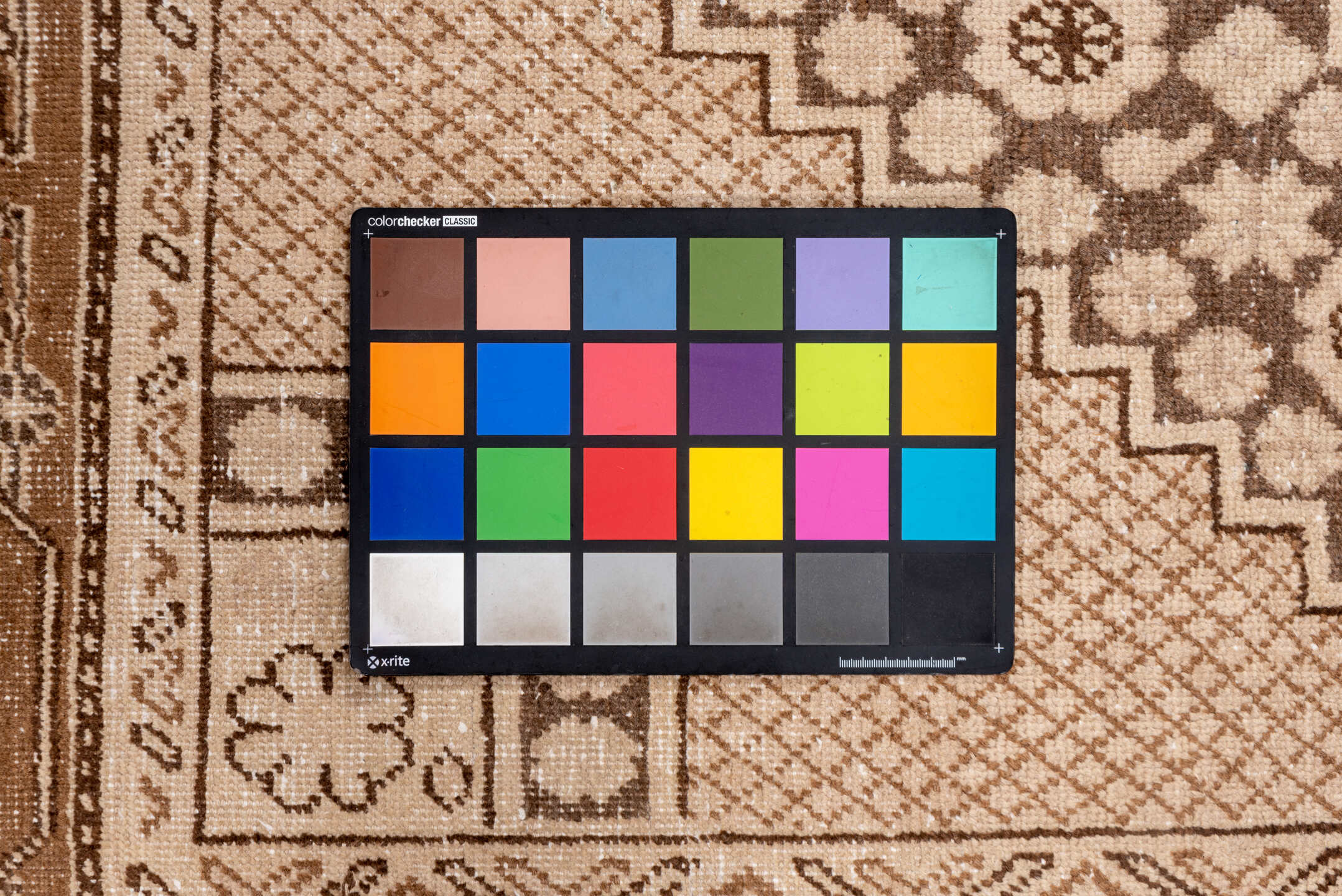 5' x 8' one-of-a-kind handmade vintage Khotan medium size rug. Color palette: brown, gray, light gray, off-white, orange