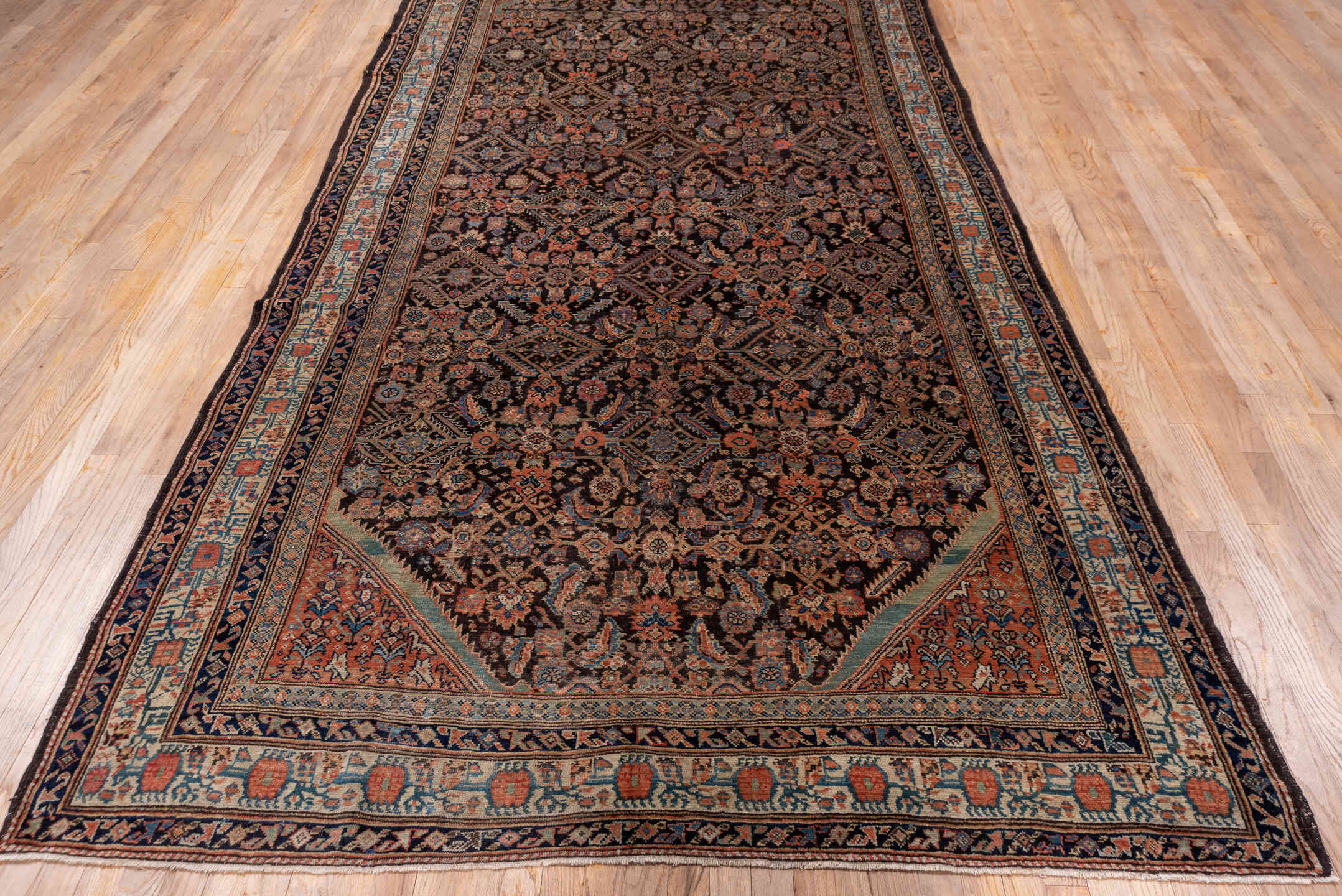 3' x 12' one-of-a-kind handmade vintage Tulu runner rug. Color palette: deep brown, terracotta, ivory, muted blue, navy