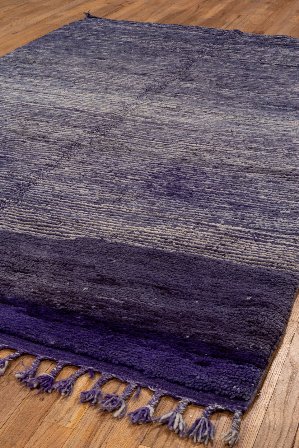 5' x 8' one-of-a-kind handmade vintage Moroccan medium size rug. Color palette: violet, indigo, lavender, charcoal, pink