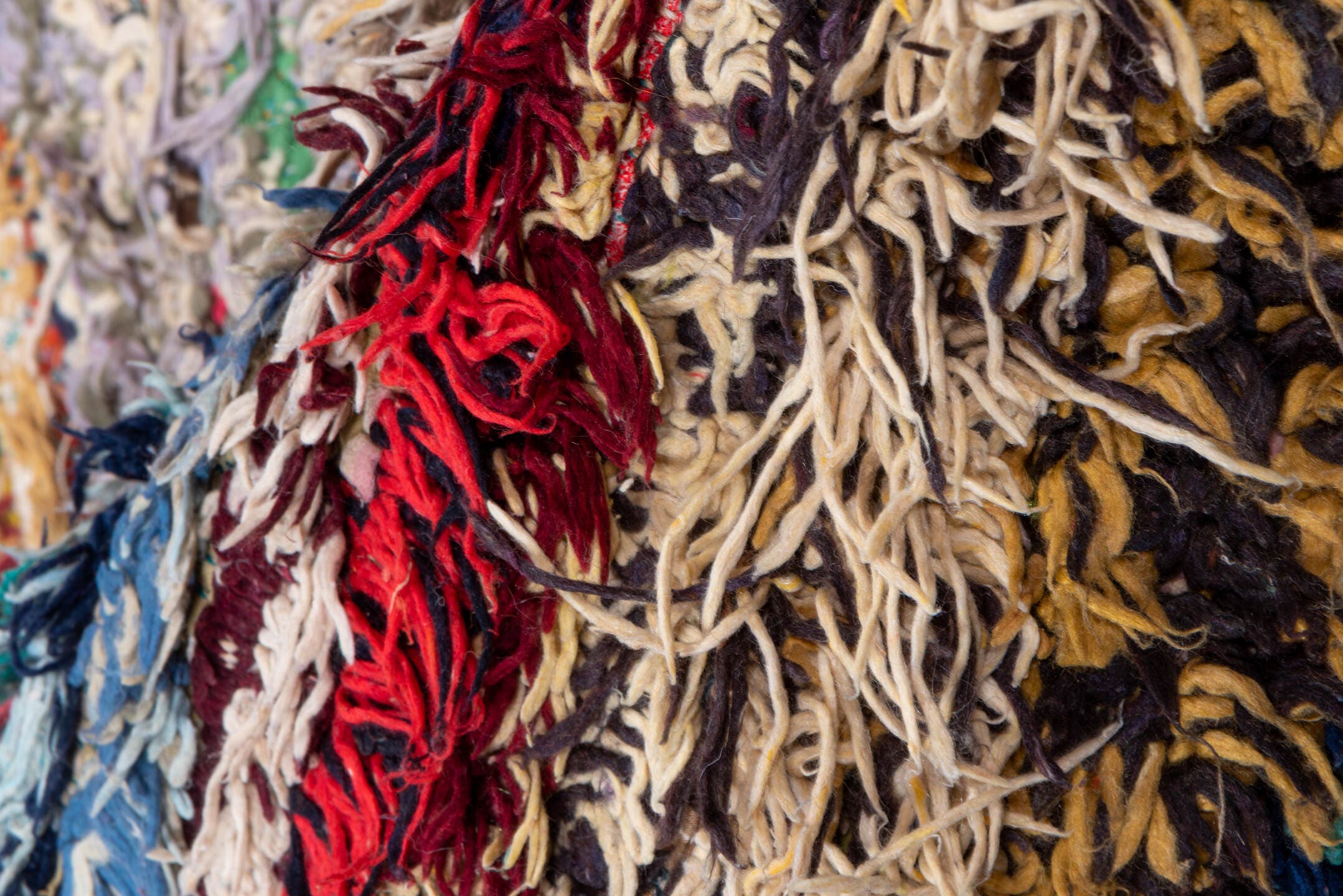 4' x 10' one-of-a-kind handmade vintage Rag Rug runner rug. Color palette: ivory, burgundy, teal, tan, blue, cream, red