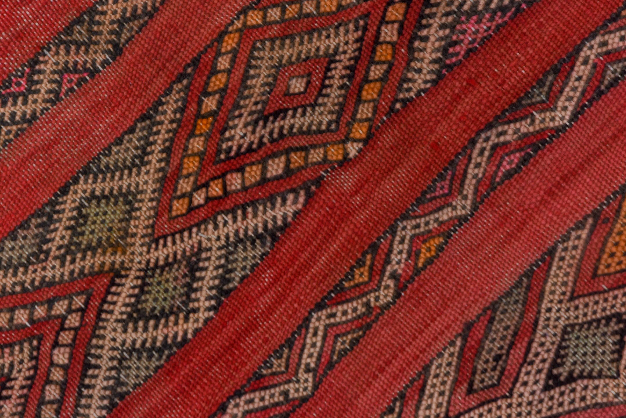 5' x 7' one-of-a-kind handmade vintage Kilim rug. Color palette: rose, rust, charcoal, taupe, ochre, pink, ivory, red