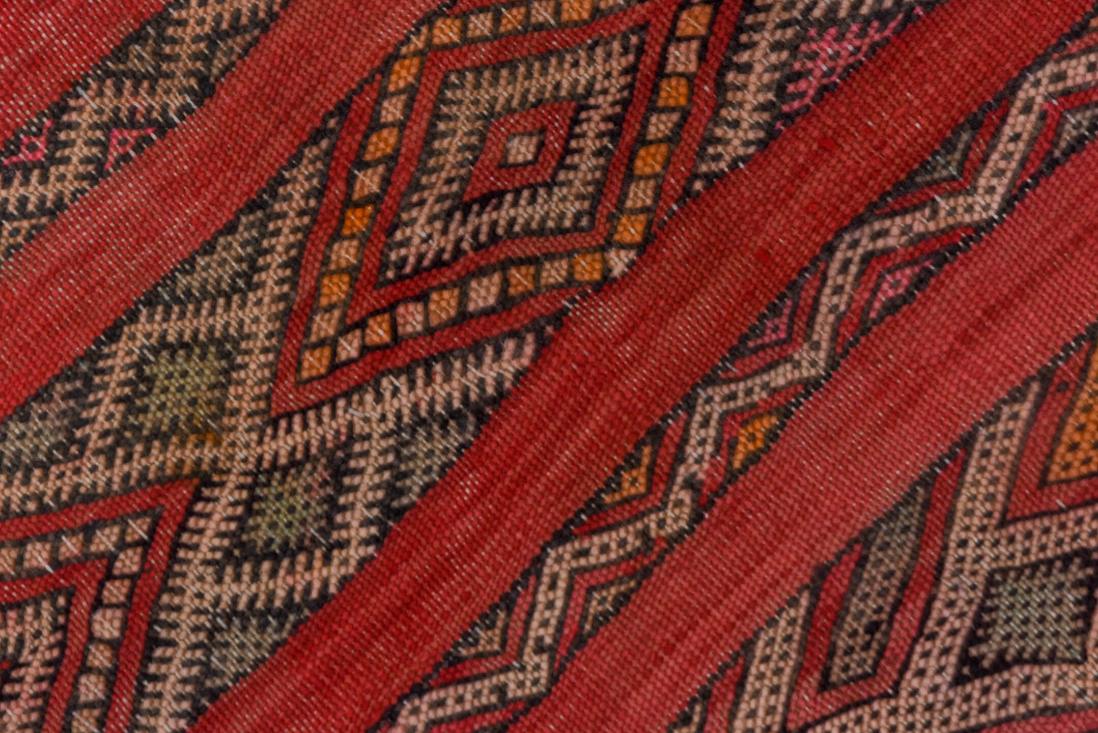 5' x 7' one-of-a-kind handmade vintage Kilim rug. Color palette: rose, rust, charcoal, taupe, ochre, pink, ivory, red