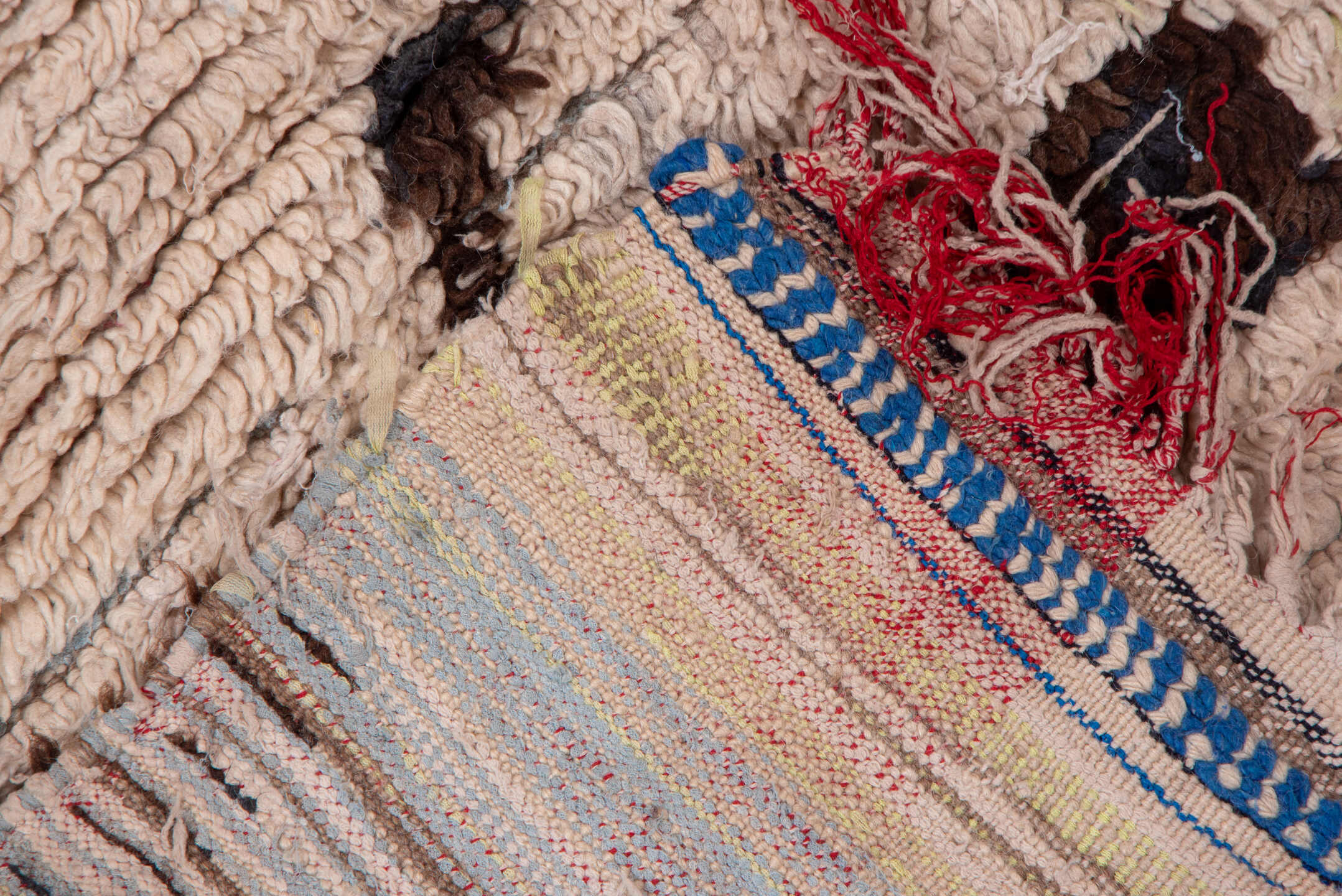 4' x 6' one-of-a-kind handmade vintage Moroccan small size rug. Color palette: ivory, brown, crimson, cobalt, teal, rose