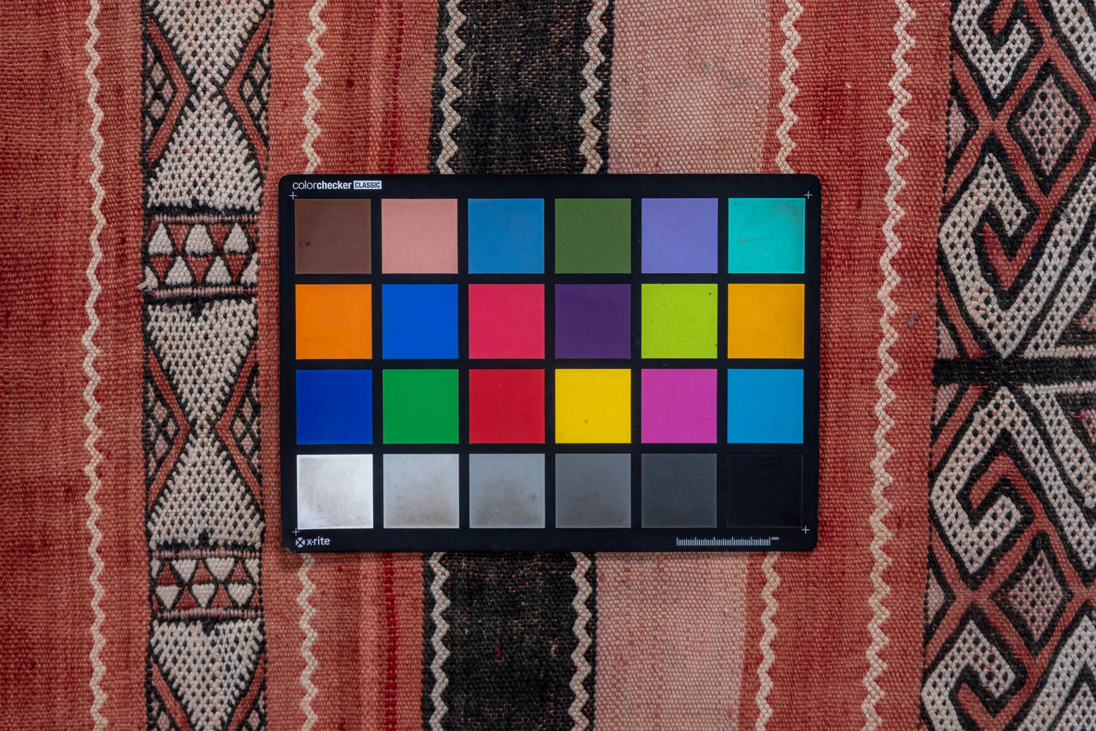 5' x 8' one-of-a-kind handmade vintage Jijim medium size rug. Color palette: black, brown, gray, light gray, orange, pink