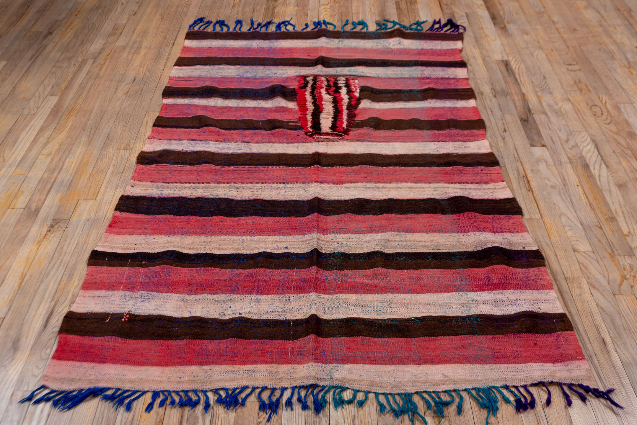 4' x 7' one-of-a-kind handmade vintage Moroccan rug. Color palette: rose, ivory, dark brown, burgundy, indigo, teal, pink