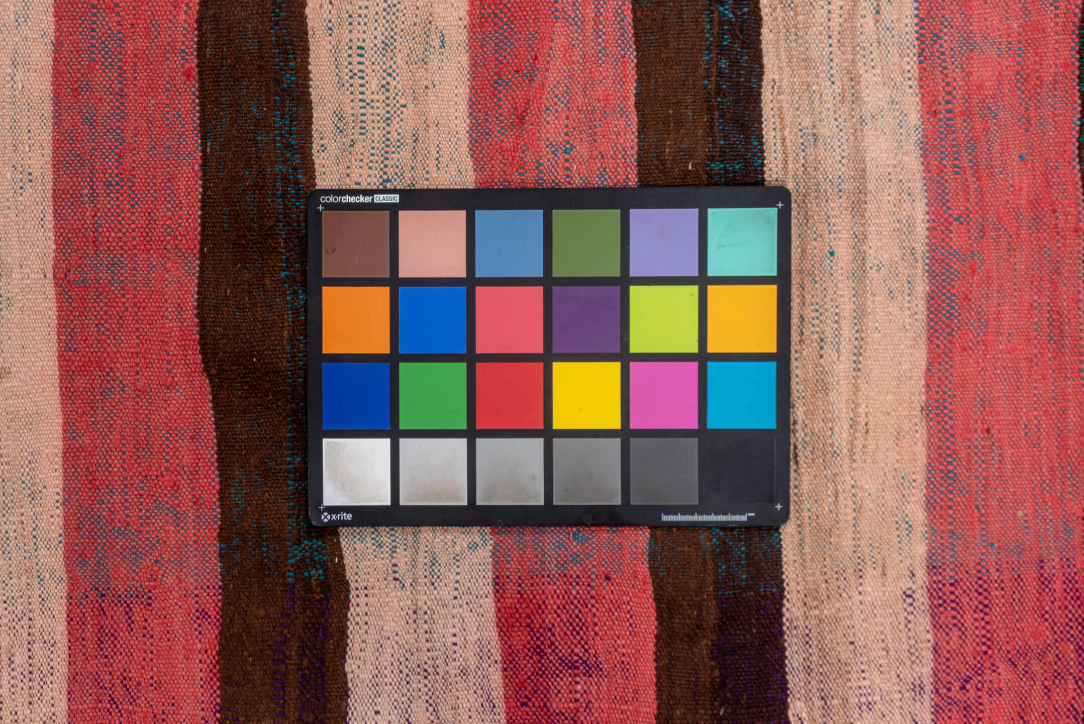 4' x 7' one-of-a-kind handmade vintage Moroccan rug. Color palette: black, blue, brown, gray, pink, red, wine