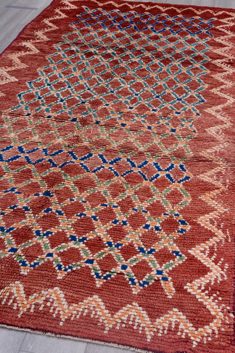 4' x 11' one-of-a-kind handmade antique Moroccan runner rug. Color palette: red, ivory, blue, coral, green, rose, terracotta