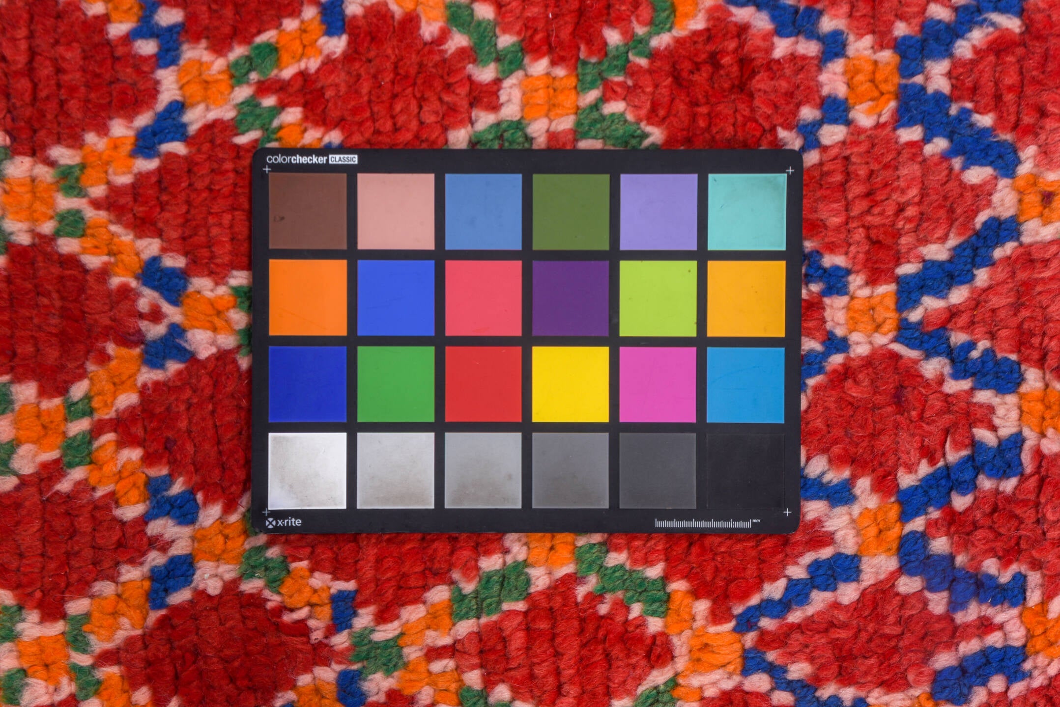 4' x 11' one-of-a-kind handmade vintage Moroccan runner rug. Color palette: black, blue, brown, dark salmon, fire brick