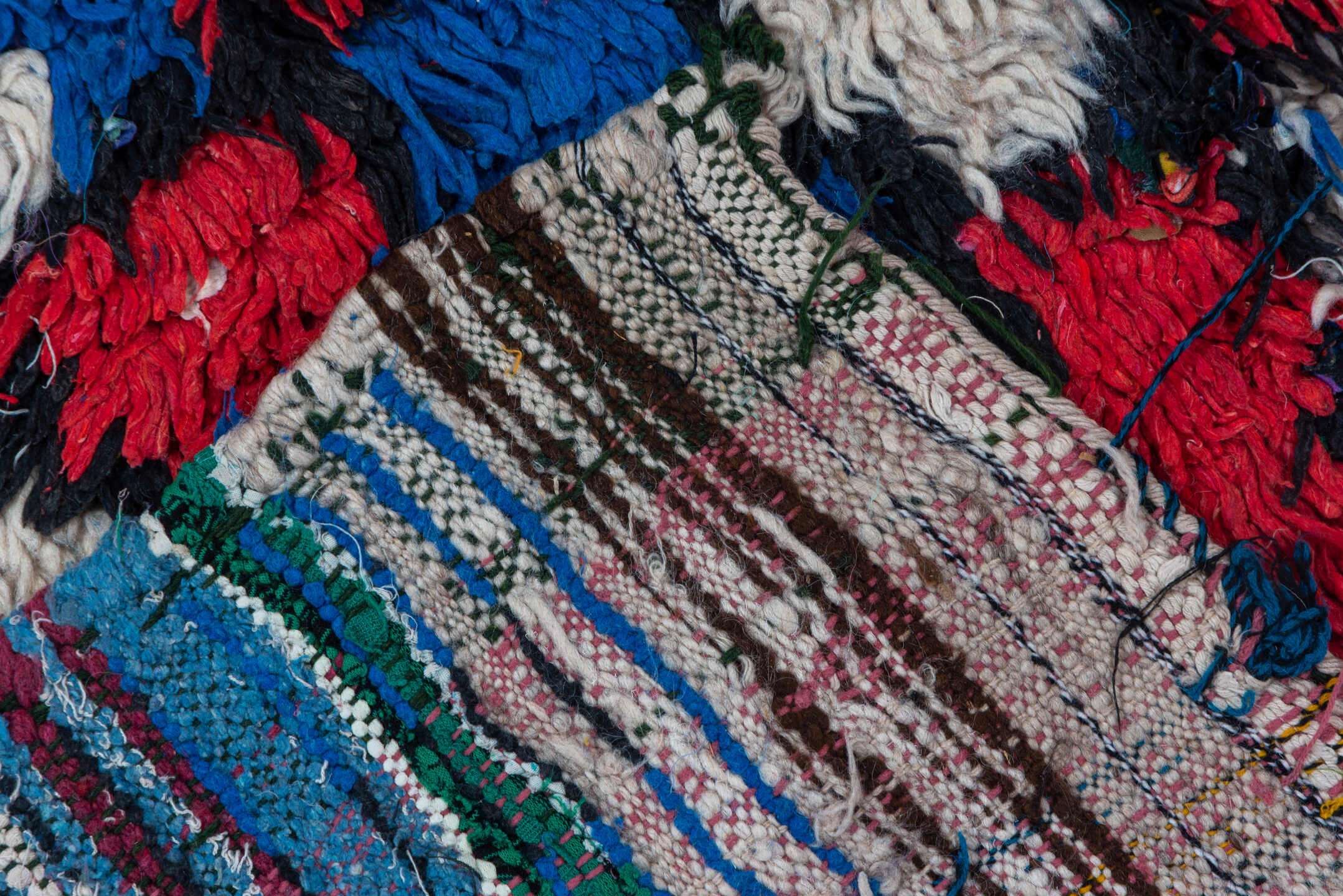 4' x 10' one-of-a-kind handmade vintage Moroccan runner rug. Color palette: ivory, cobalt, crimson, black, blue, red