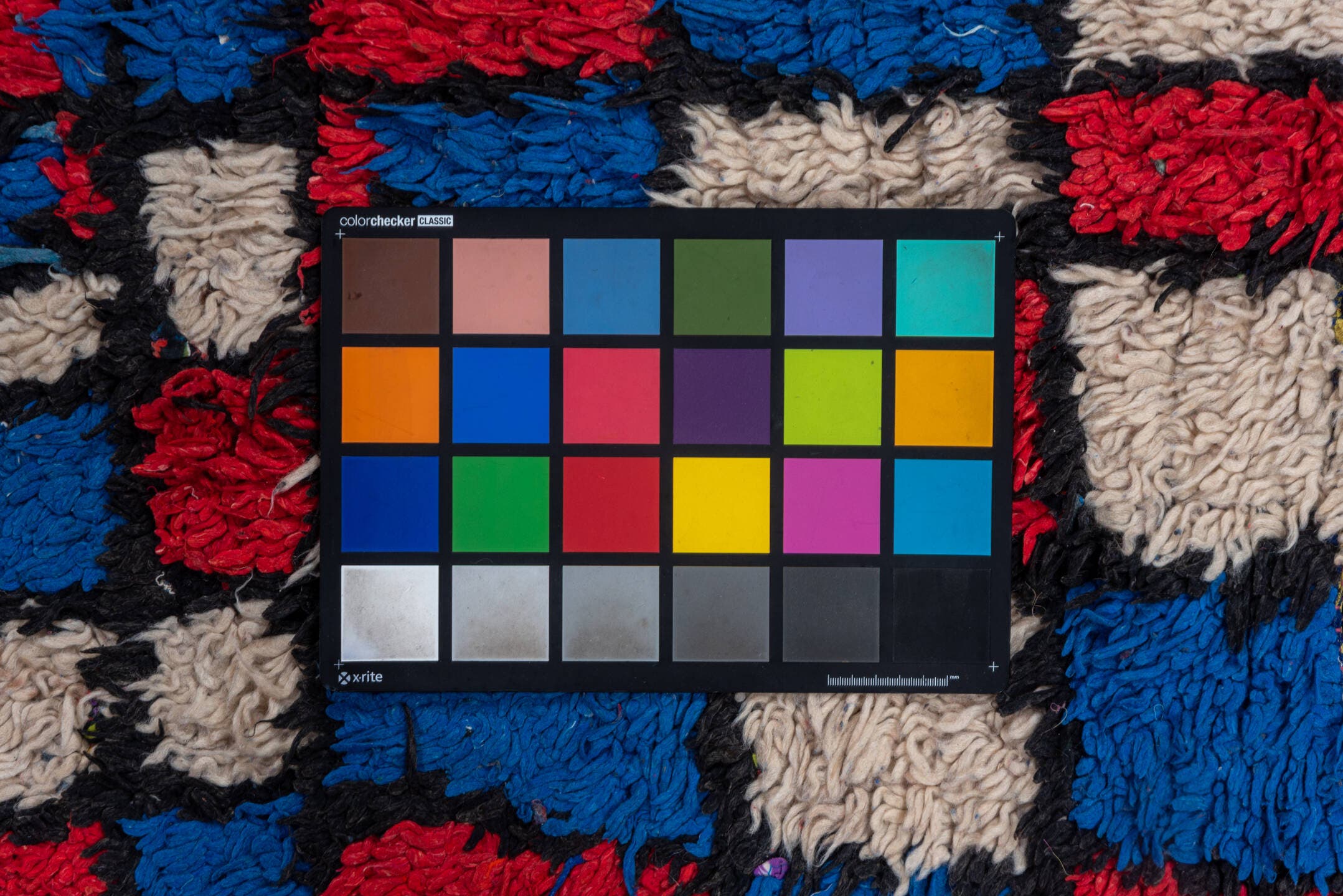 4' x 10' one-of-a-kind handmade vintage Moroccan runner rug. Color palette: ivory, cobalt, crimson, black, blue, red
