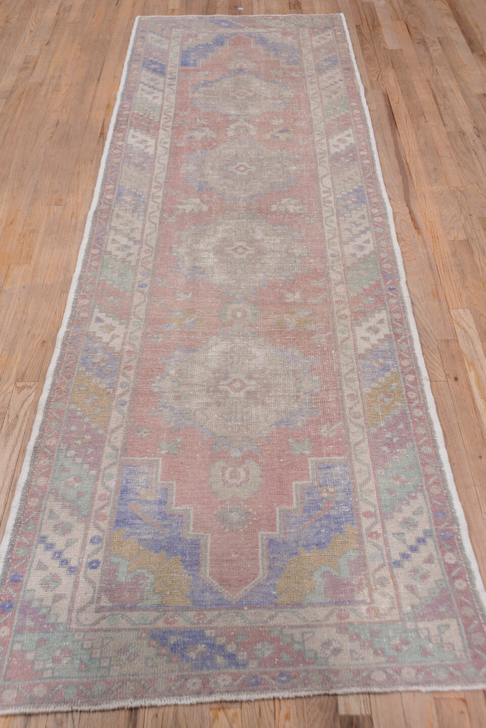 3' x 10' one-of-a-kind handmade vintage Oushak runner rug. Color palette: rose, taupe, ivory, lavender, sage, dusty blue