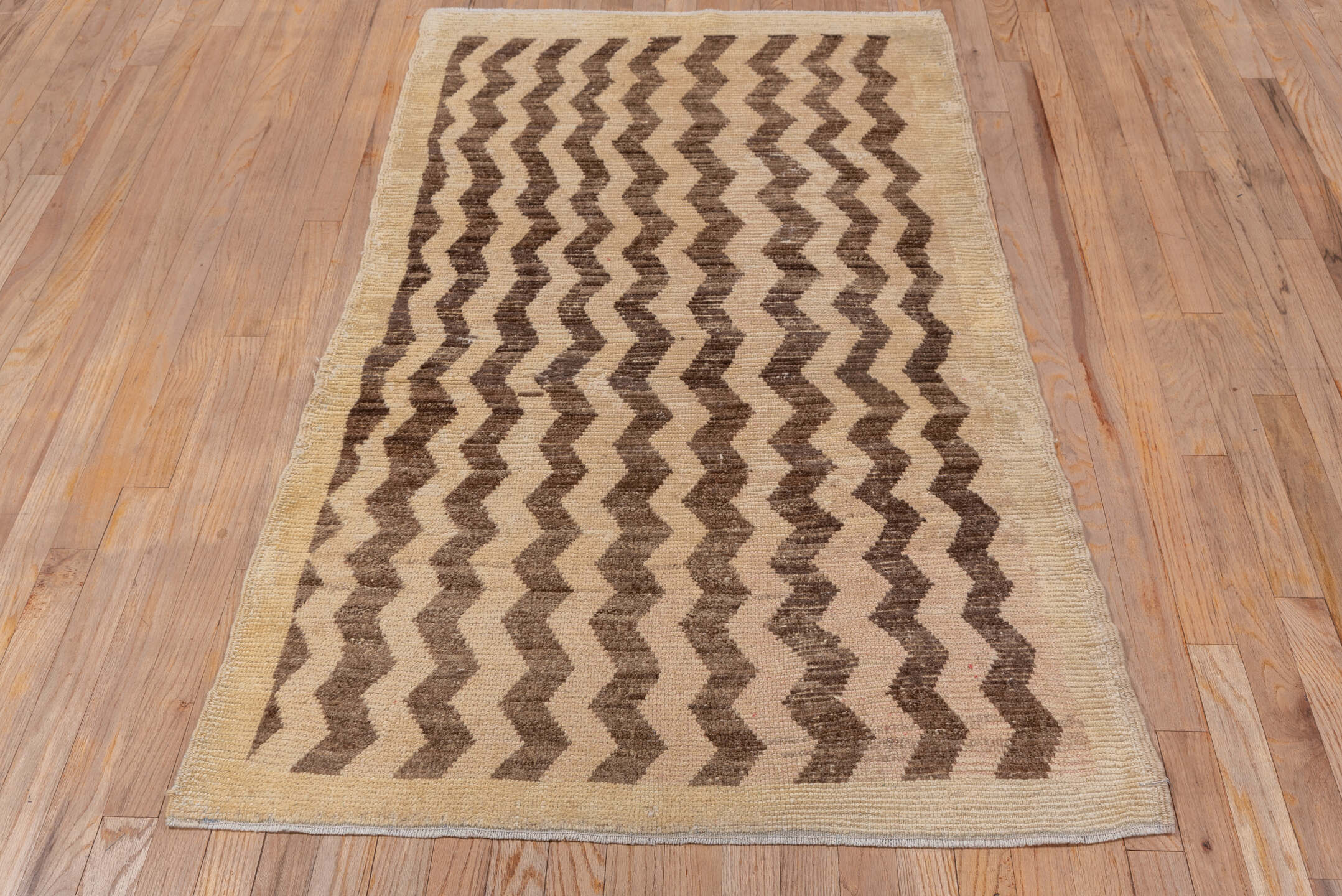 3' x 6' one-of-a-kind handmade vintage Tulu small size rug. Color palette: brown, gray, light gray, off-white, orange, pink