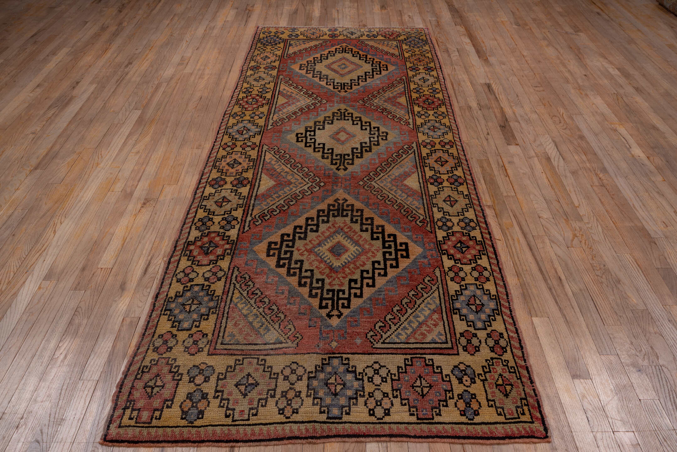 4' x 10' one-of-a-kind handmade vintage Oushak runner rug. Color palette: camel, rust, blue, ivory, charcoal, rose, taupe
