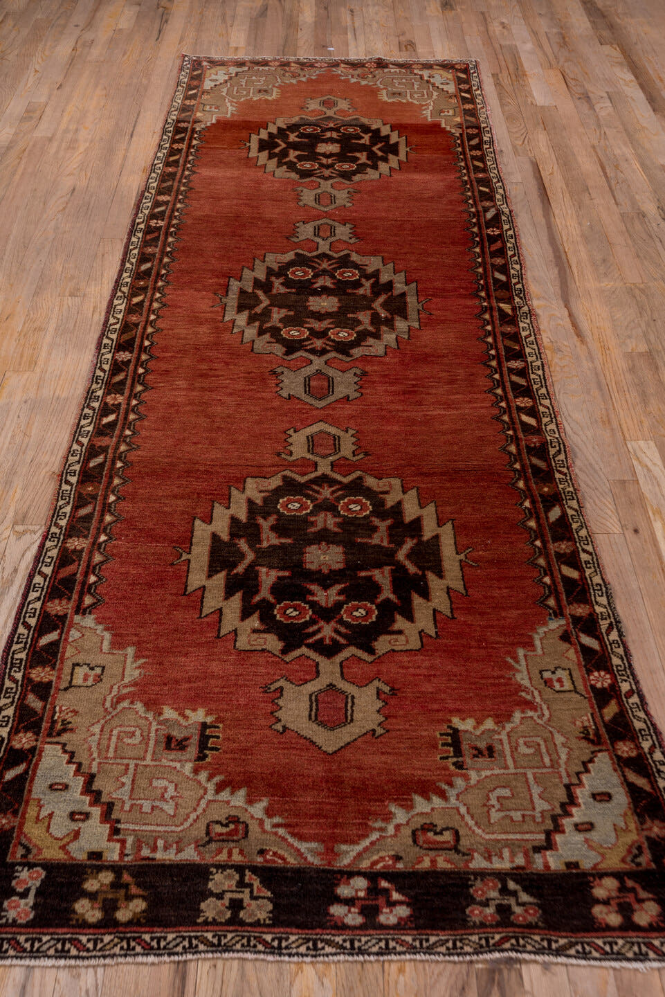 3' x 10' one-of-a-kind handmade vintage Oushak runner rug. Color palette: terra cotta, rust, ivory, taupe, charcoal, rose