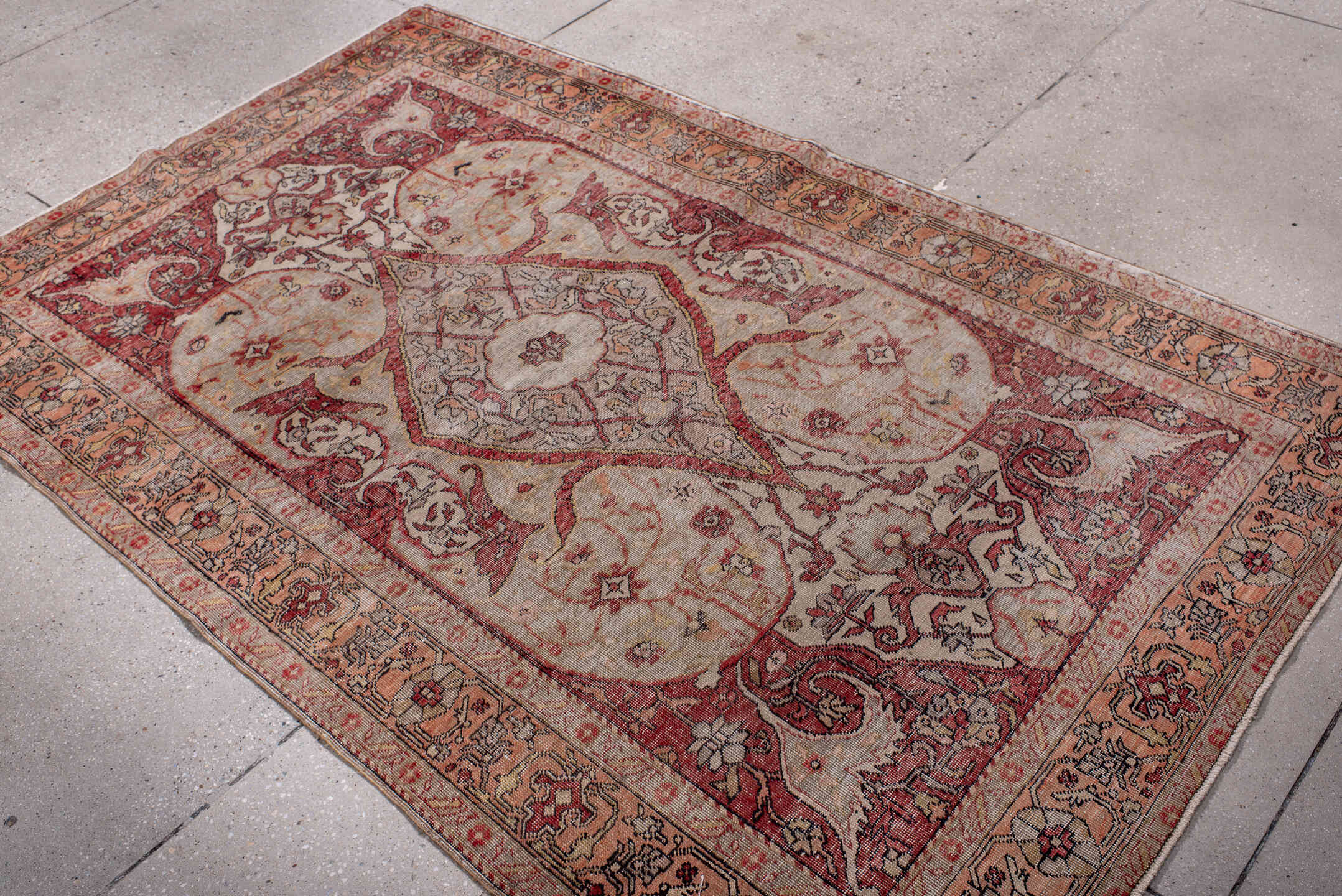 4' x 7' one-of-a-kind handmade vintage Oushak rug. Color palette: black, brown, gray, light gray, pink, red, redwood, wine