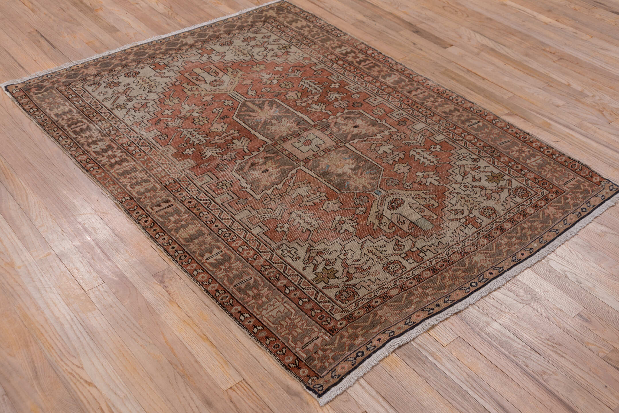 4' x 5' one-of-a-kind handmade vintage Serapi small size rug. Color palette: brown, gray, pink, red, redwood