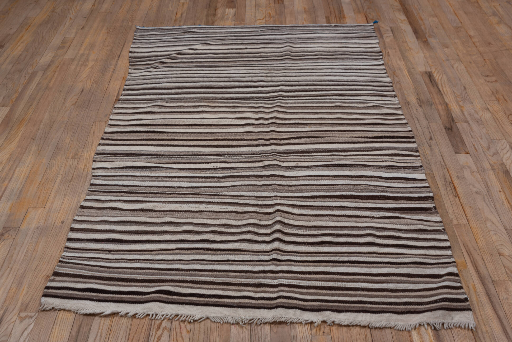 4' x 6' one-of-a-kind handmade vintage Blanket small size rug. Color palette: ivory, taupe, brown, charcoal, beige, gray