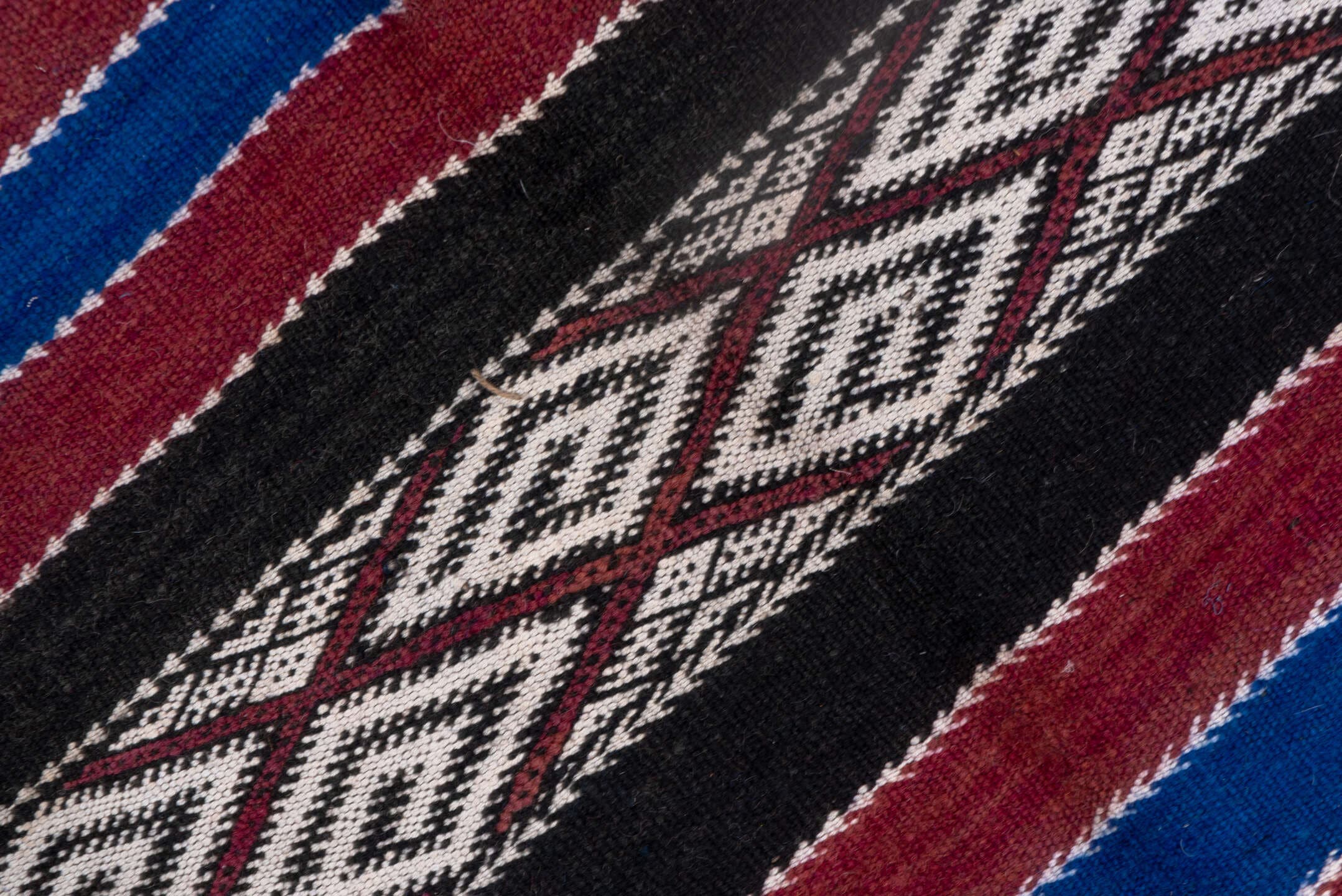 5' x 11' one-of-a-kind handmade vintage Kilim runner rug. Color palette: black, burgundy, indigo, ivory, gray, purple