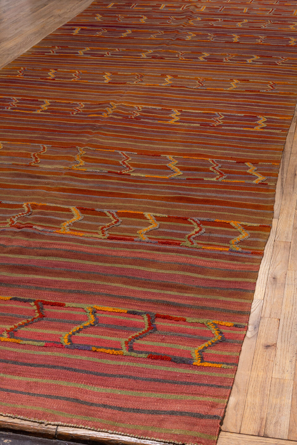 5' x 18' one-of-a-kind handmade antique Kilim rug. Color palette: rust, terra cotta, crimson, mauve, saffron, rose, taupe