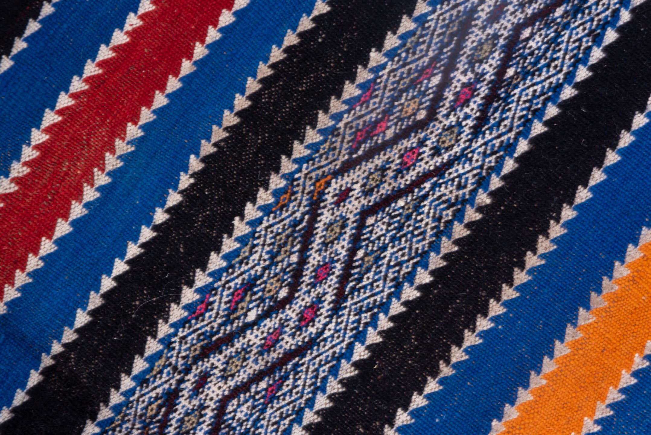 5' x 11' one-of-a-kind handmade vintage Kilim rug. Color palette: indigo, ivory, charcoal, rust, burgundy, blue, purple