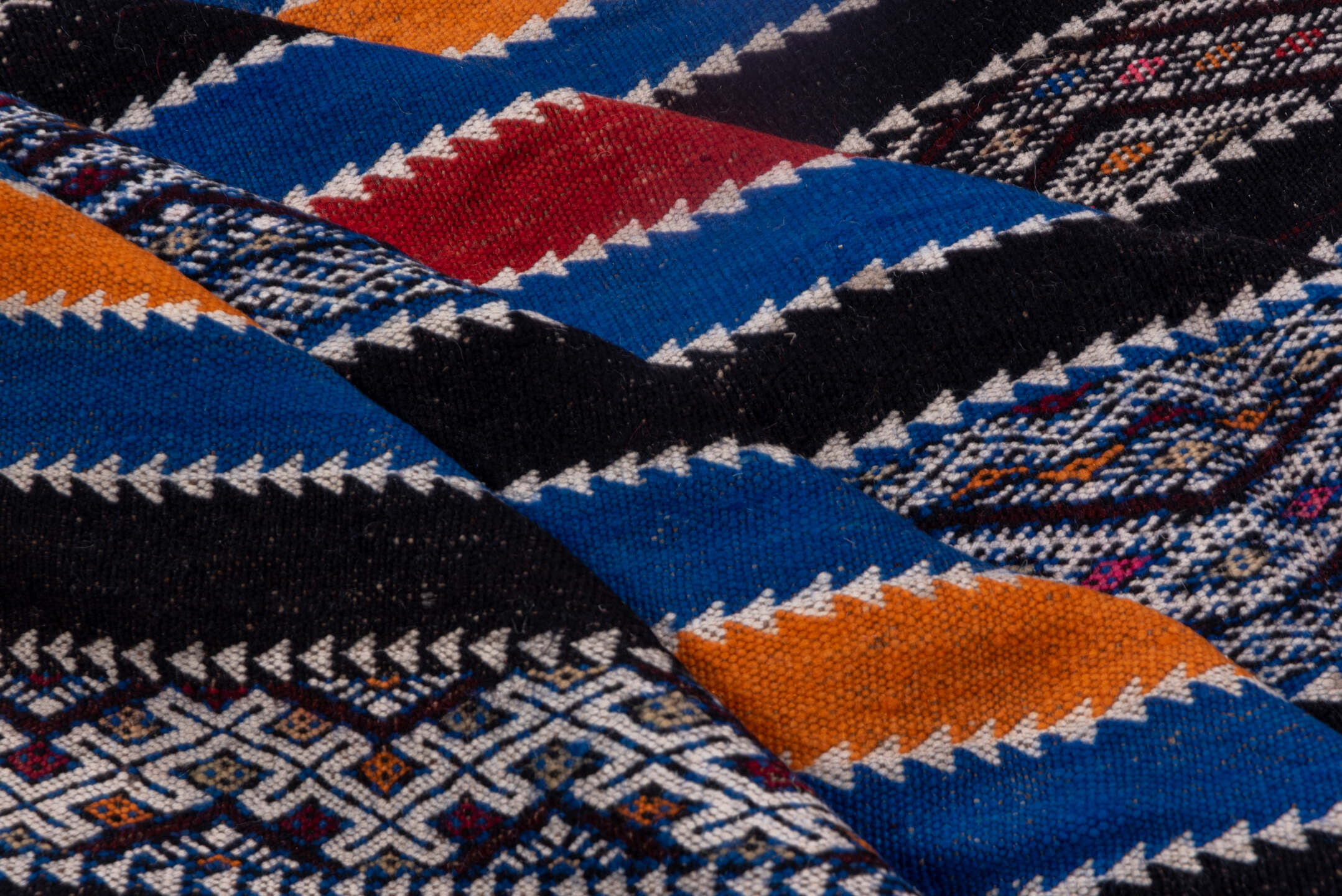 5' x 11' one-of-a-kind handmade vintage Kilim rug. Color palette: indigo, ivory, charcoal, rust, burgundy, blue, purple