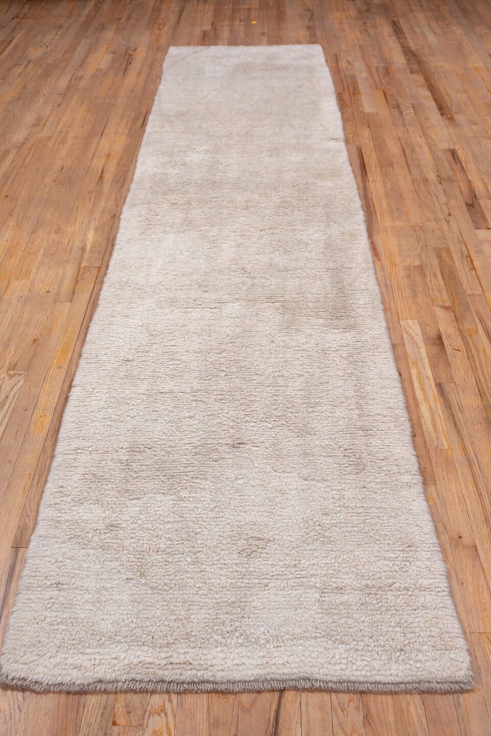 2' x 12' one-of-a-kind handmade vintage Moroccan runner rug. Color palette: ivory, cream, beige