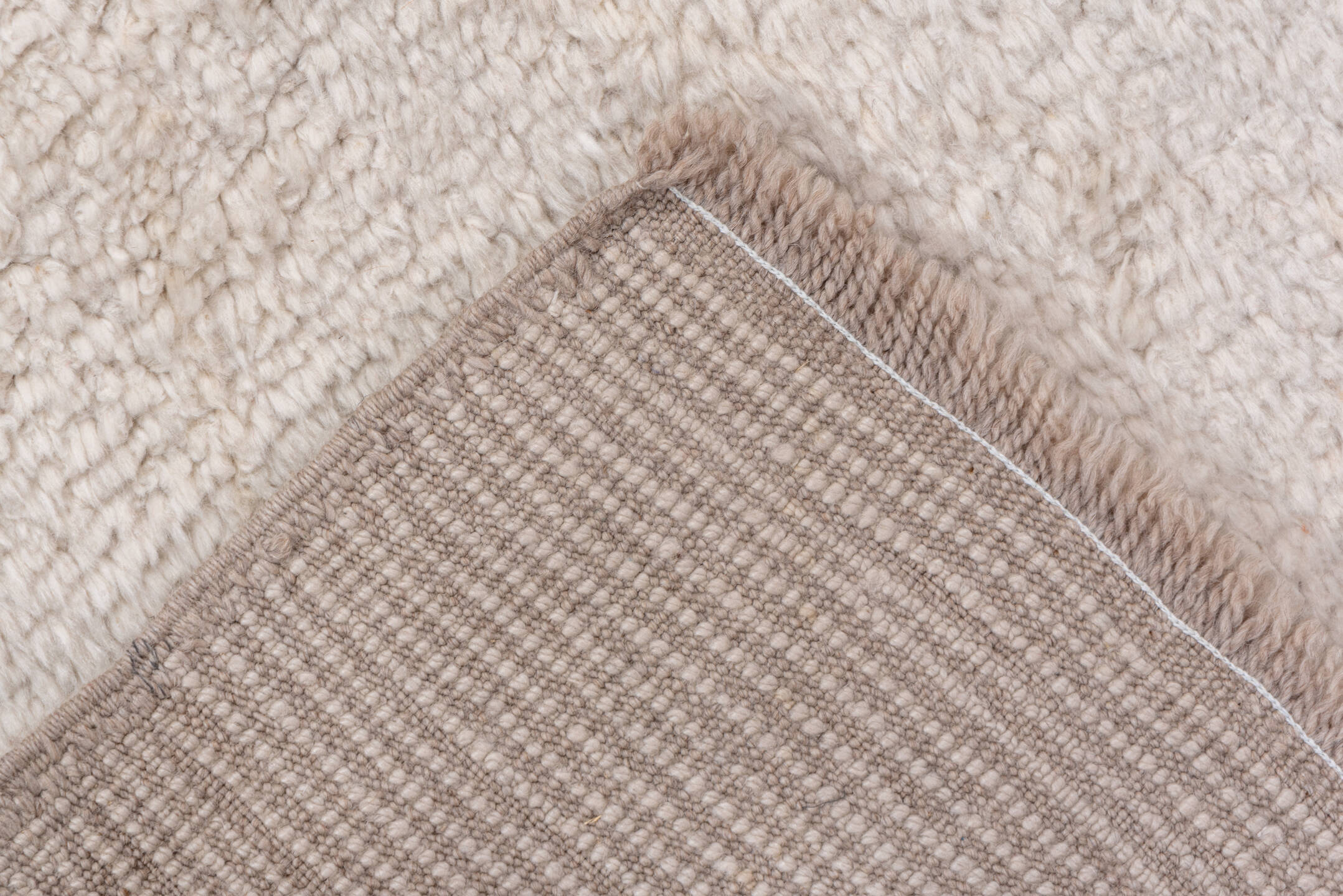2' x 12' one-of-a-kind handmade vintage Moroccan runner rug. Color palette: ivory, cream, beige