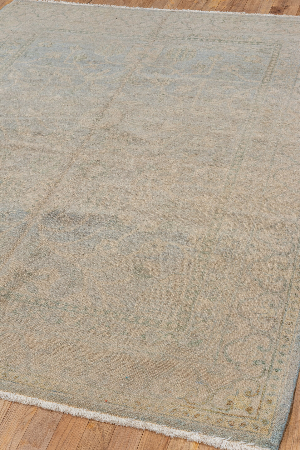 5' x 7' one-of-a-kind handmade vintage Khotan rug. Color palette: beige, ivory, pale blue, taupe, sage, light blue, gray