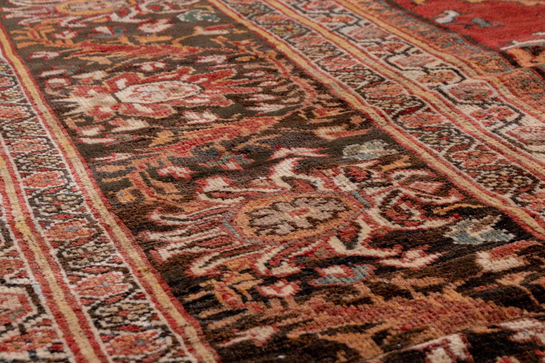 11' x 19' one-of-a-kind handmade antique Sultanabad oversize rug. Color palette: terra cotta, brown, ivory, gold, navy, sage