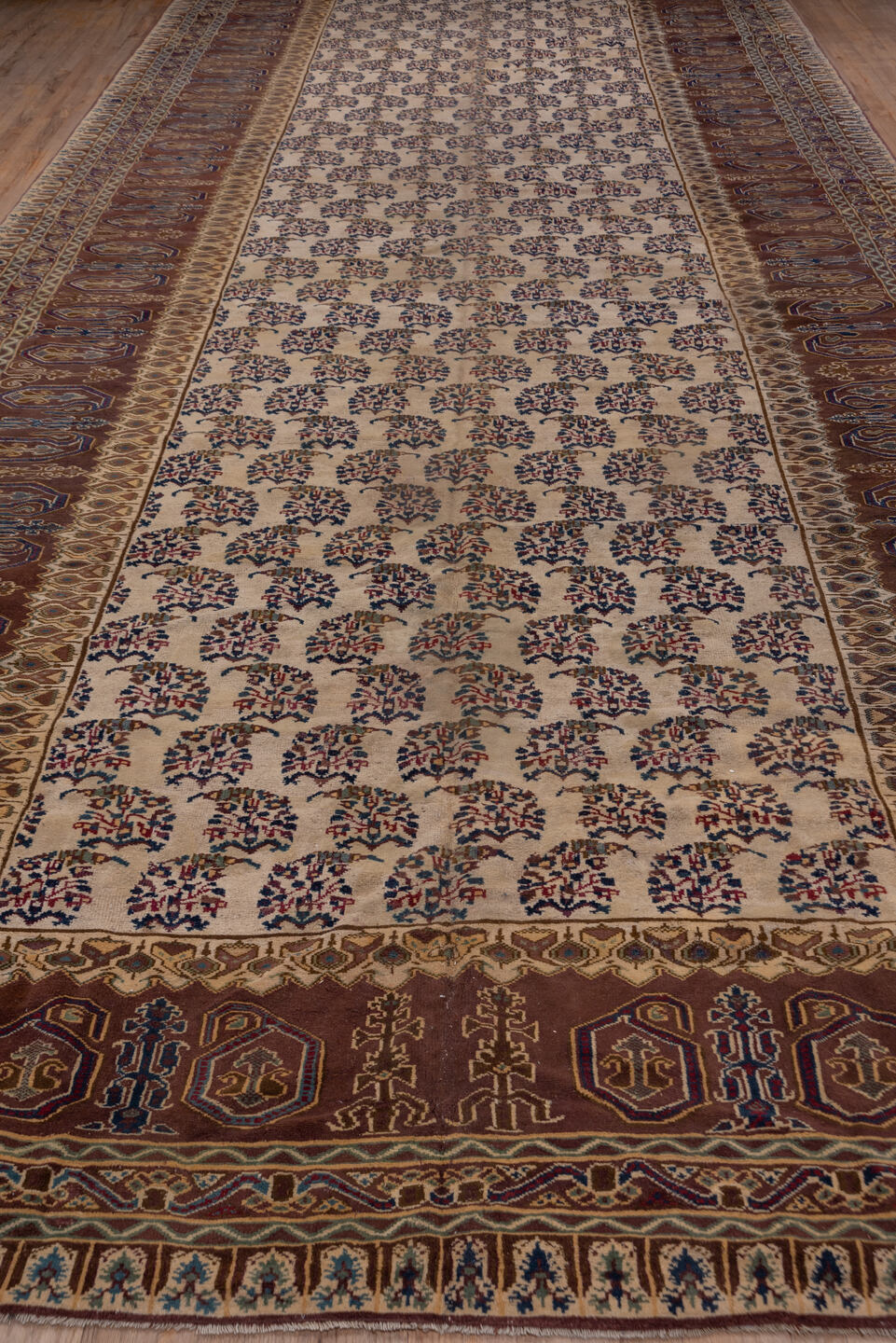 9' x 24' one-of-a-kind handmade vintage Amritzar rug. Color palette: ivory, brown, navy, taupe, rust, gold, blue, beige