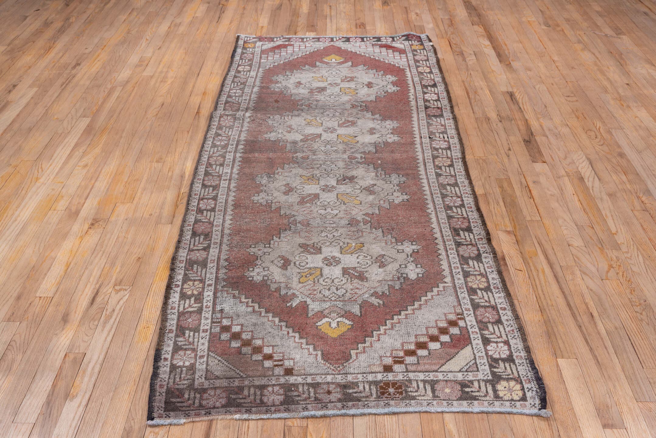 3' x 9' one-of-a-kind handmade vintage Oushak runner rug. Color palette: terra cotta, ivory, taupe, charcoal, gold, rose
