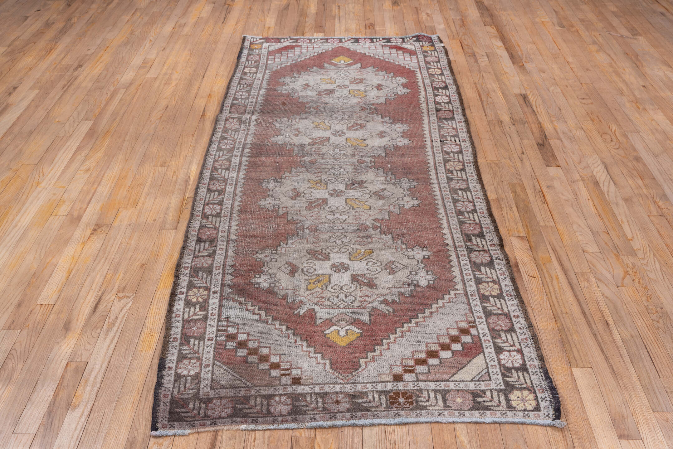 3' x 9' one-of-a-kind handmade vintage Oushak runner rug. Color palette: terra cotta, ivory, taupe, charcoal, gold, rose
