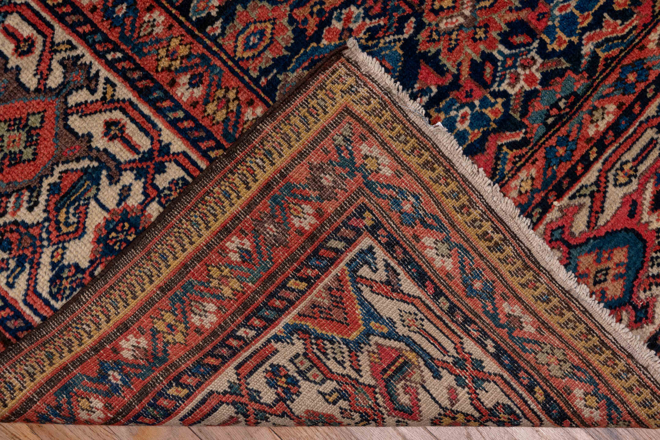 7' x 17' one-of-a-kind handmade antique Mahal rug. Color palette: navy, rust, ivory, coral, indigo, camel, burgundy, blue