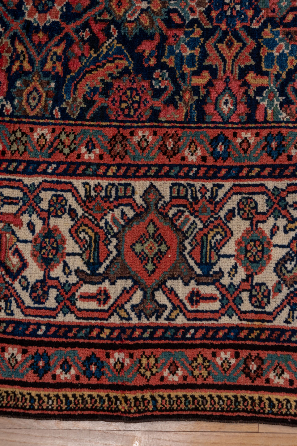 7' x 17' one-of-a-kind handmade antique Mahal rug. Color palette: navy, rust, ivory, coral, indigo, camel, burgundy, blue