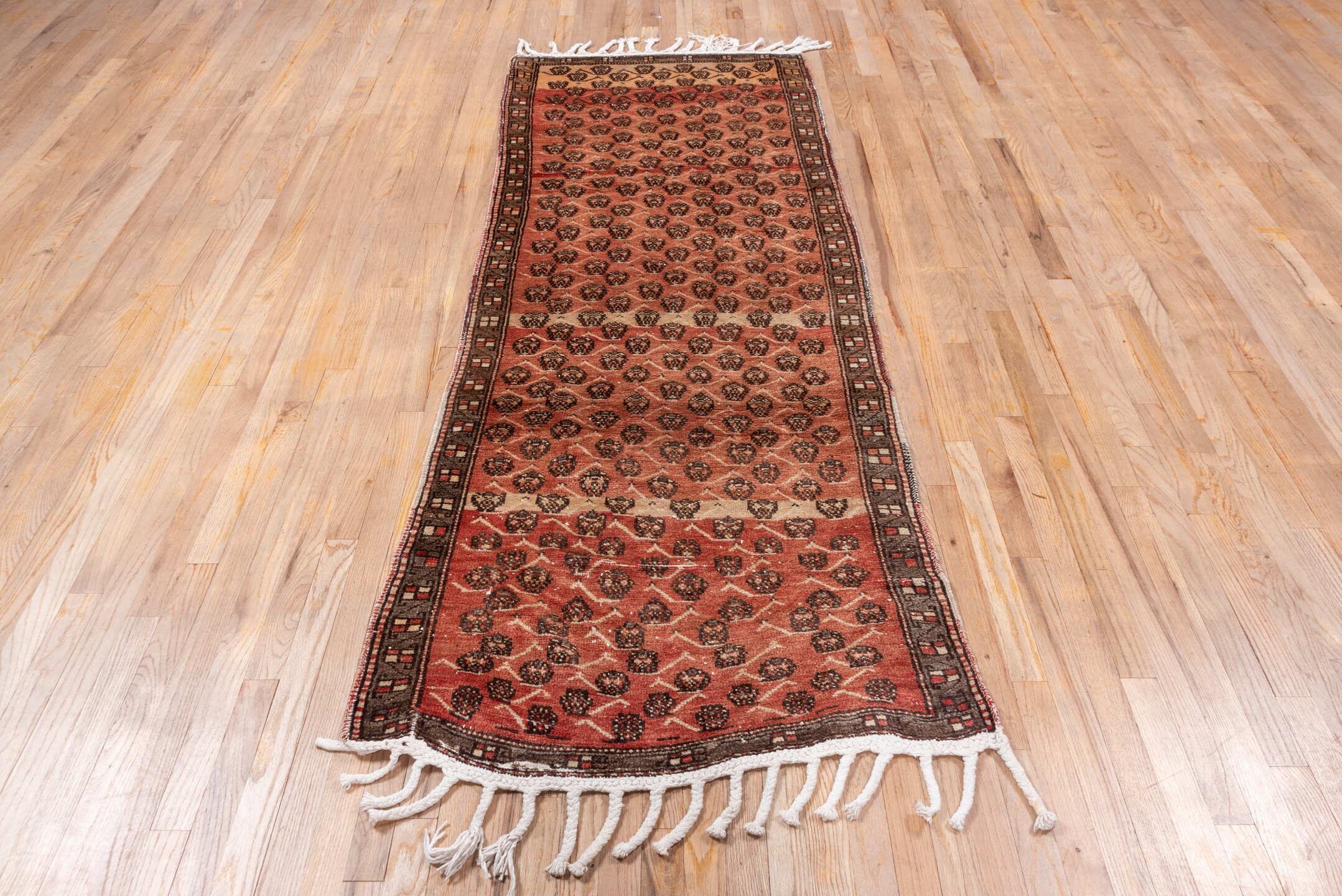 3' x 8' one-of-a-kind handmade vintage Oushak runner rug. Color palette: brown, gray, light gray, off-white, orange, pink