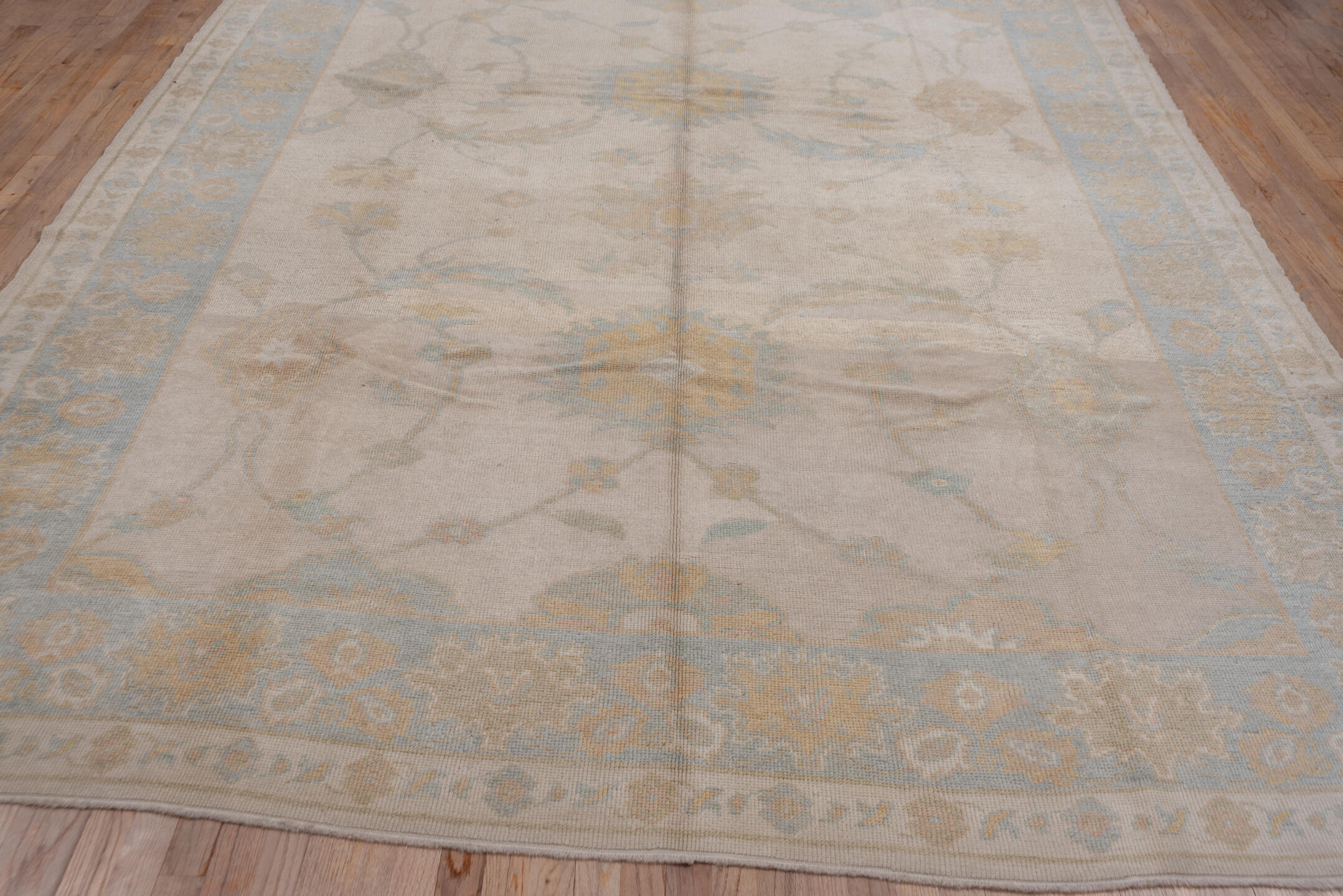 9' x 12' one-of-a-kind handmade vintage Oushak large size rug. Color palette: ivory, pale blue, taupe, gold, beige, sage