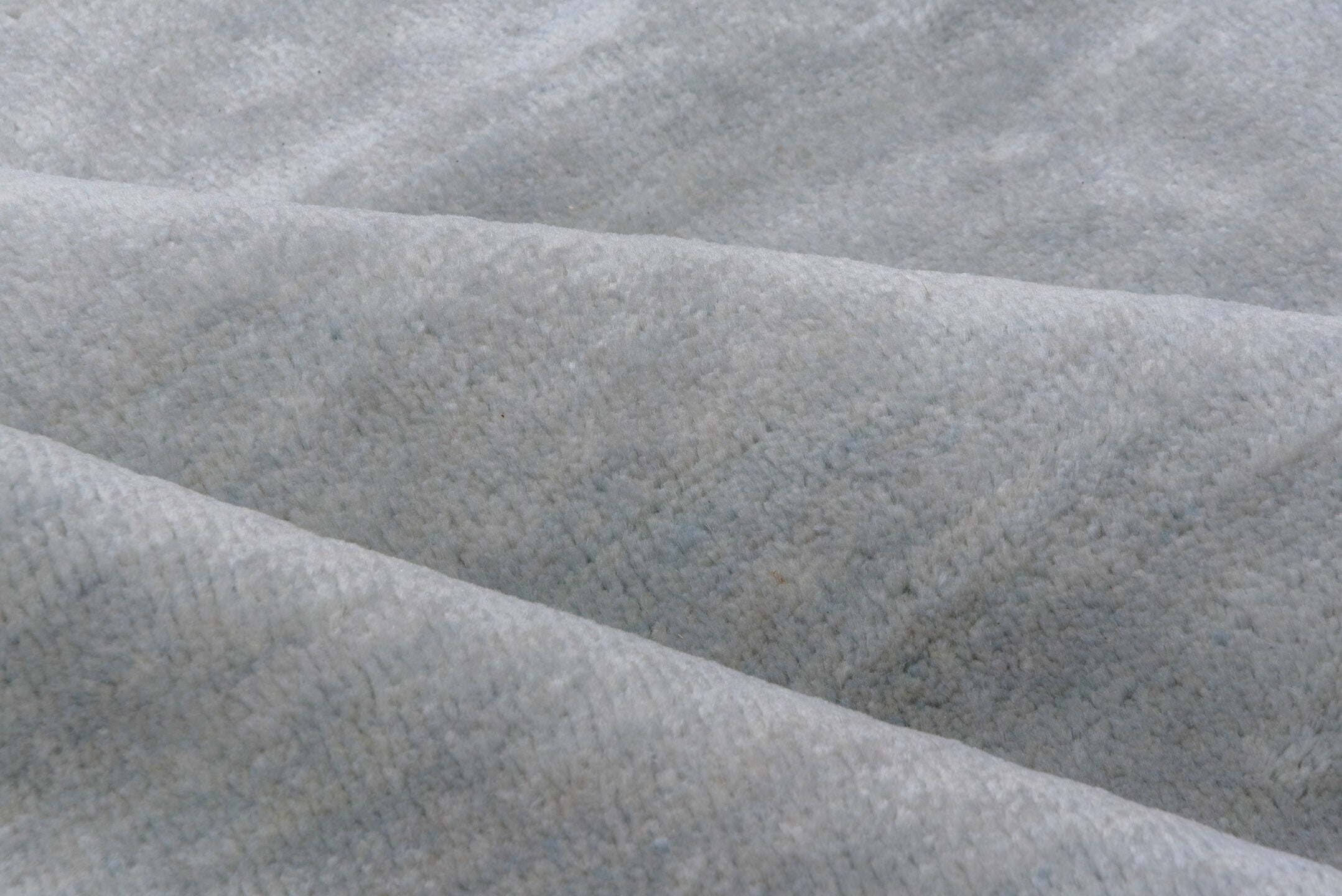 9' x 12' one-of-a-kind handmade vintage Rad large size rug. Color palette: ivory, pale blue, cream, taupe, light blue, beige