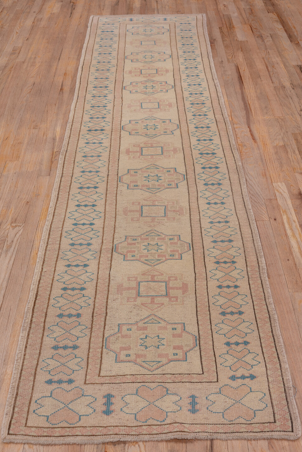 2' x 11' one-of-a-kind handmade vintage Oushak runner rug. Color palette: blush, ivory, pale blue, taupe, dusty rose, pink